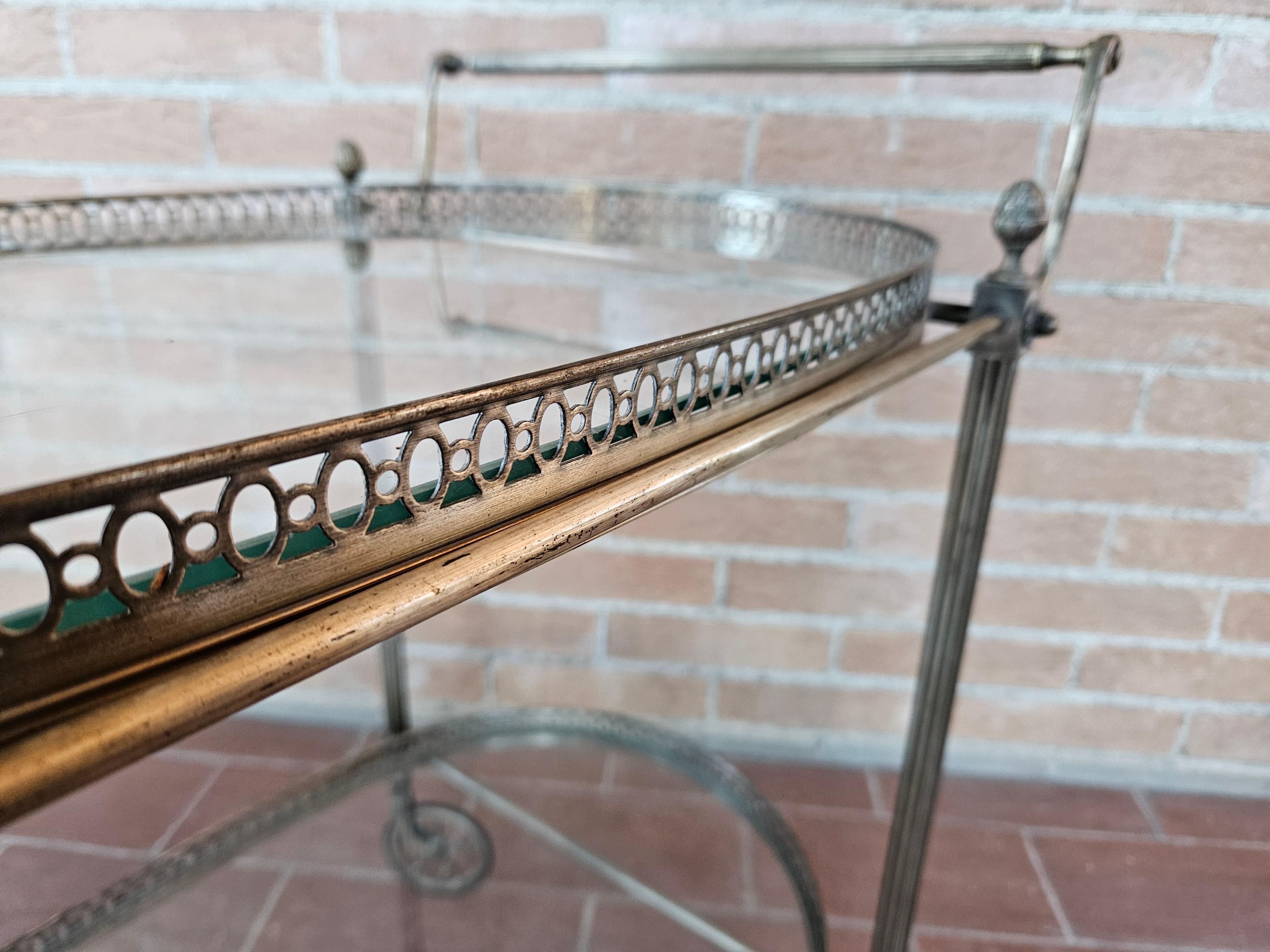 Brass 1970s hall bar cart made of machined brass and glass For Sale