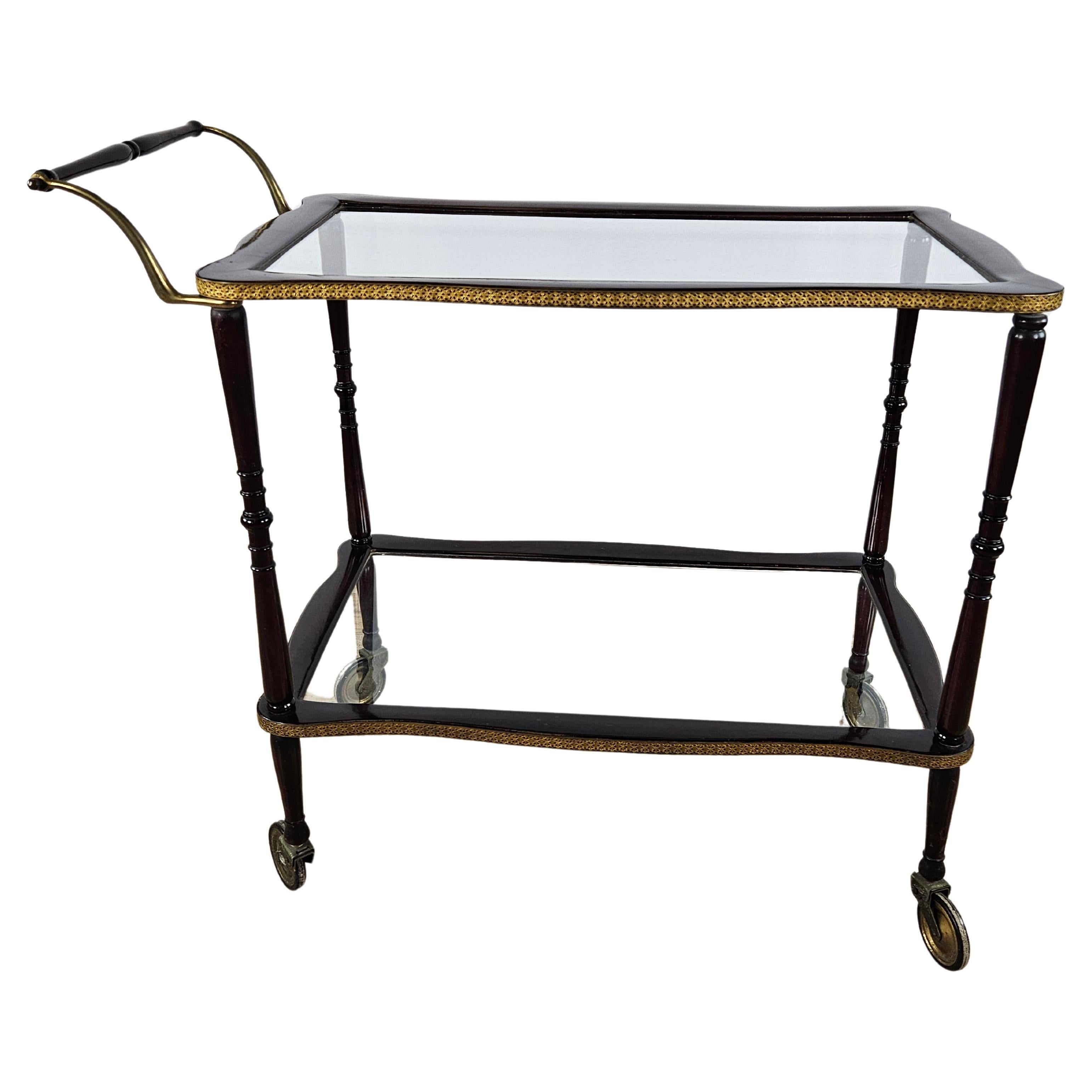Rosewood bar cart with brass profiles, 20th century For Sale