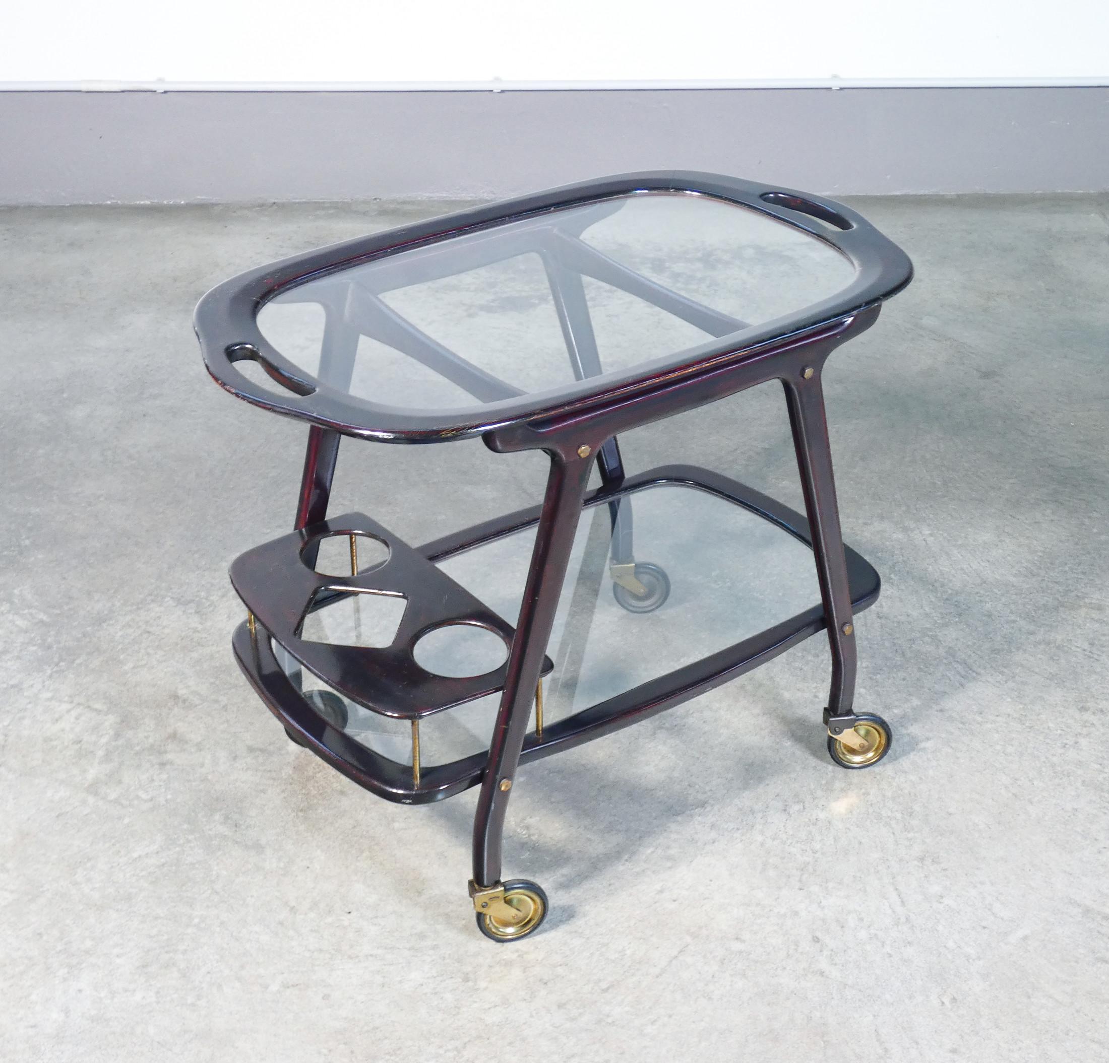 Food trolley
design Cesare LACCA,
lacquered wood and glass,
with removable tray.

ORIGIN
Italy

PERIOD
1950s

DESIGNER
Caesar LACCA

MATERIALS
Lacquered wood, brass, glass

DIMENSIONS
Height:- 63cm
Width: 80cm
Depth: 48cm

CONDITIONS
The cart is in