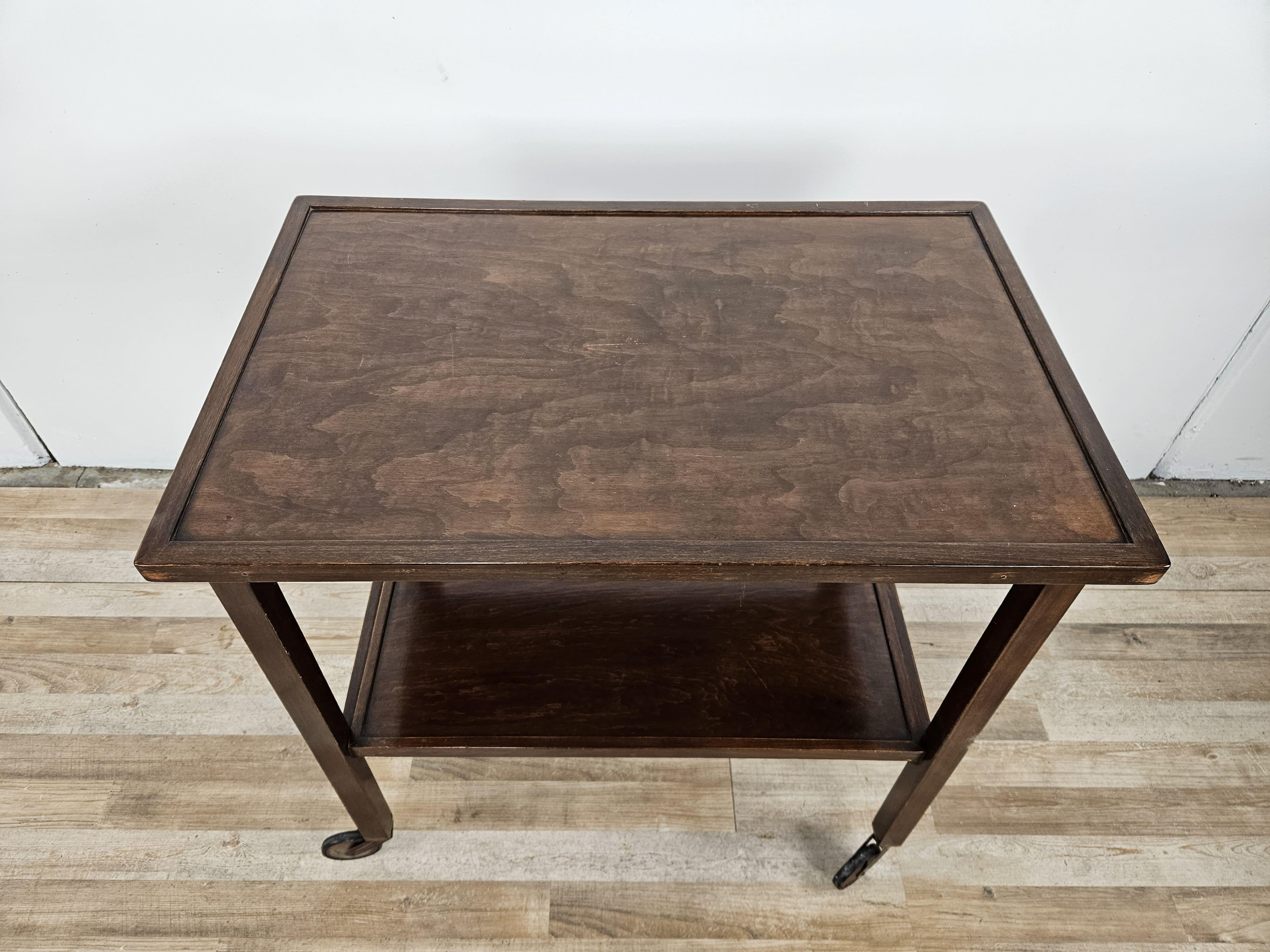 Antique Viennese coffee table by Thonet with double shelf and wheels for easy moving.

It can be used as an entry table or as a serving cart, or in a living room between sofas.

The lowest shelf is removable, the wheels turn perfectly.
Marked under