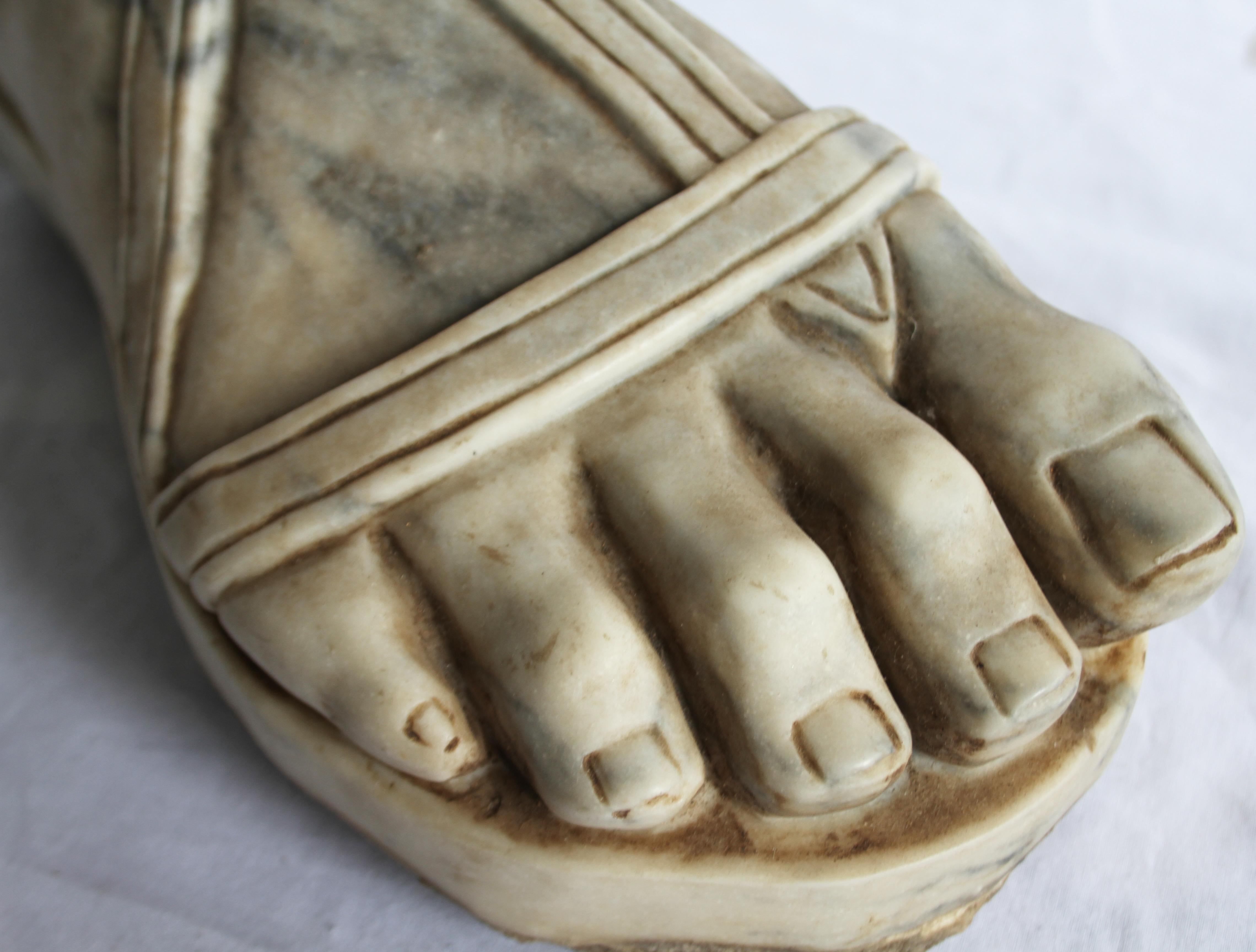 A Carrera marble carving of a Roman Centurion's foot. Italian 20th century. Realistically carved with straps.