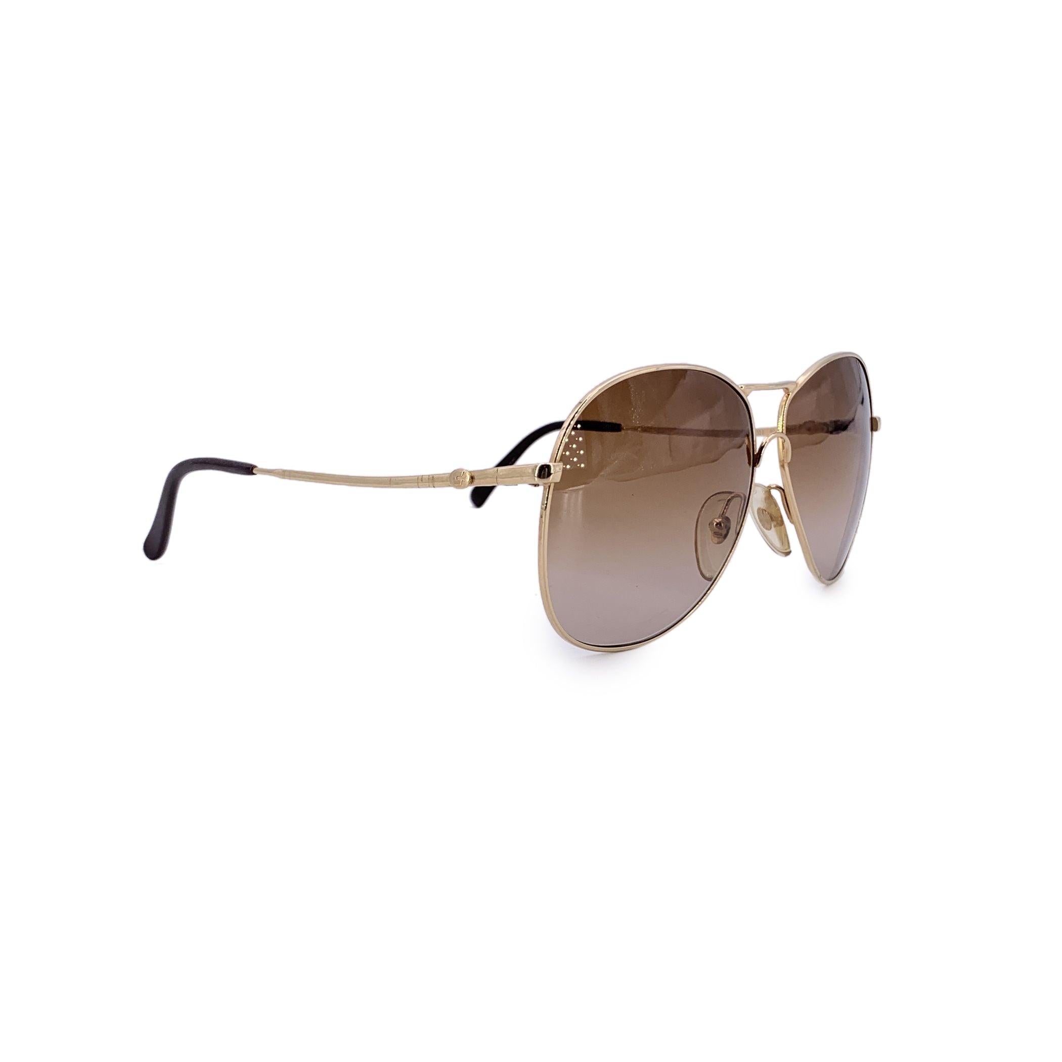 Classic and confident, these Carrera vintage sunglasses, model 5307, embody the spirit of retro-cool with a bold aviator silhouette. The gold metal frame is sleek and lightweight, offering a timeless design that has defined decades of effortless