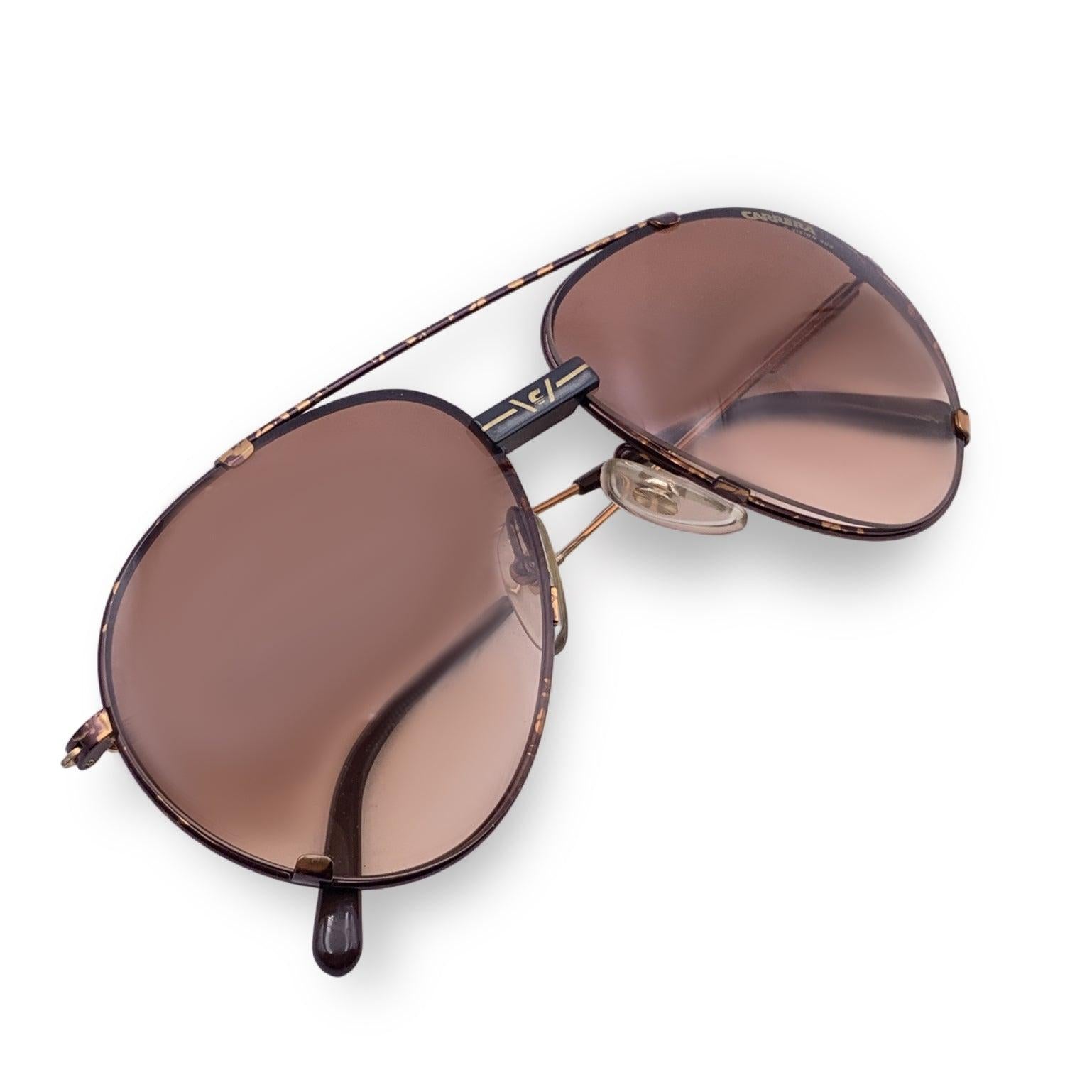 Vintage Carrera C Vision 400 Brown Metal sunglasses. Model: 5463 42. Size: 60/16 140mm. Brown metal frame and gold temples with brown acetate on the finish. 100% Total UVA/UVB protection. Gradient Brown lenses. Carrera branding to the bridge.