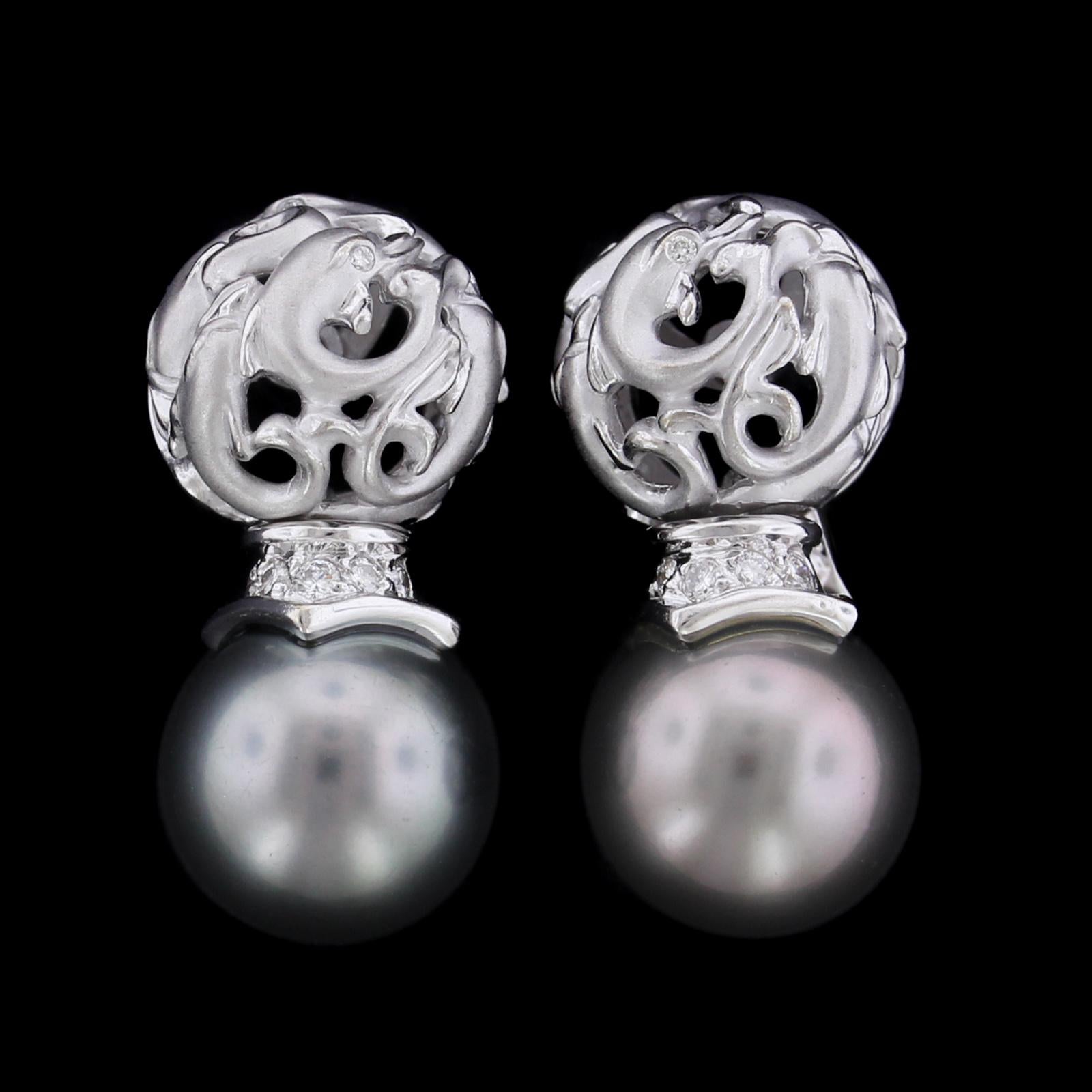 Carrera Y Carrera 18K White Gold Cultured Black Pearl and Diamond Dolphin
Earrings. The earrings suspend two cultured pearls each measuring 10.50mm.,
further set with full cut diamond accents, approx. .15cttw., HI color, SI clarity, length 1