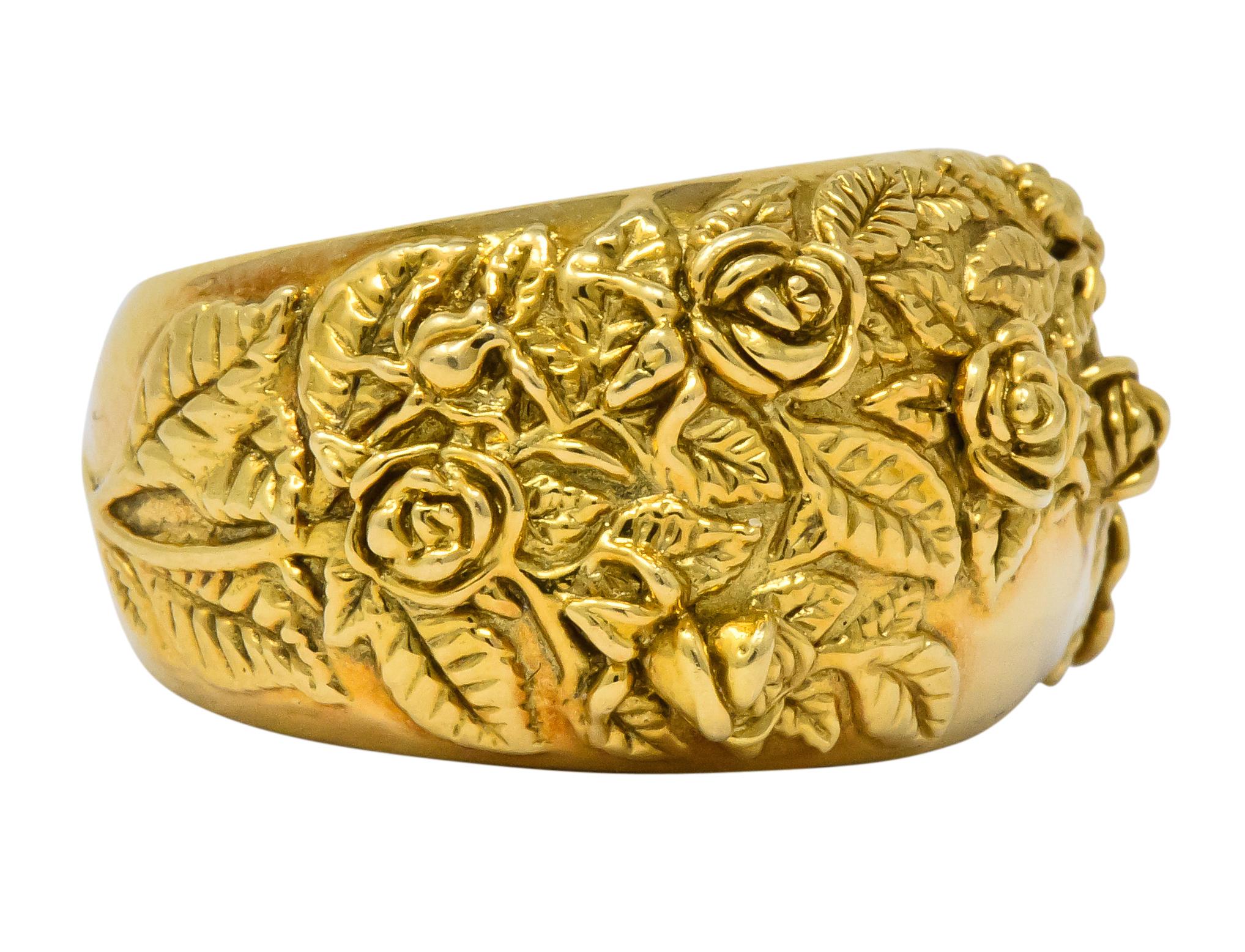 Set to the front with raised polished and textured gold roses, blossoms, leaves and stems 

Bombé style ring

From the Garden of Roses Collection

Circa 1990's

Maker's mark for Carrera y Carrera, numbered 312553, and stamped 750 for 18 karat
