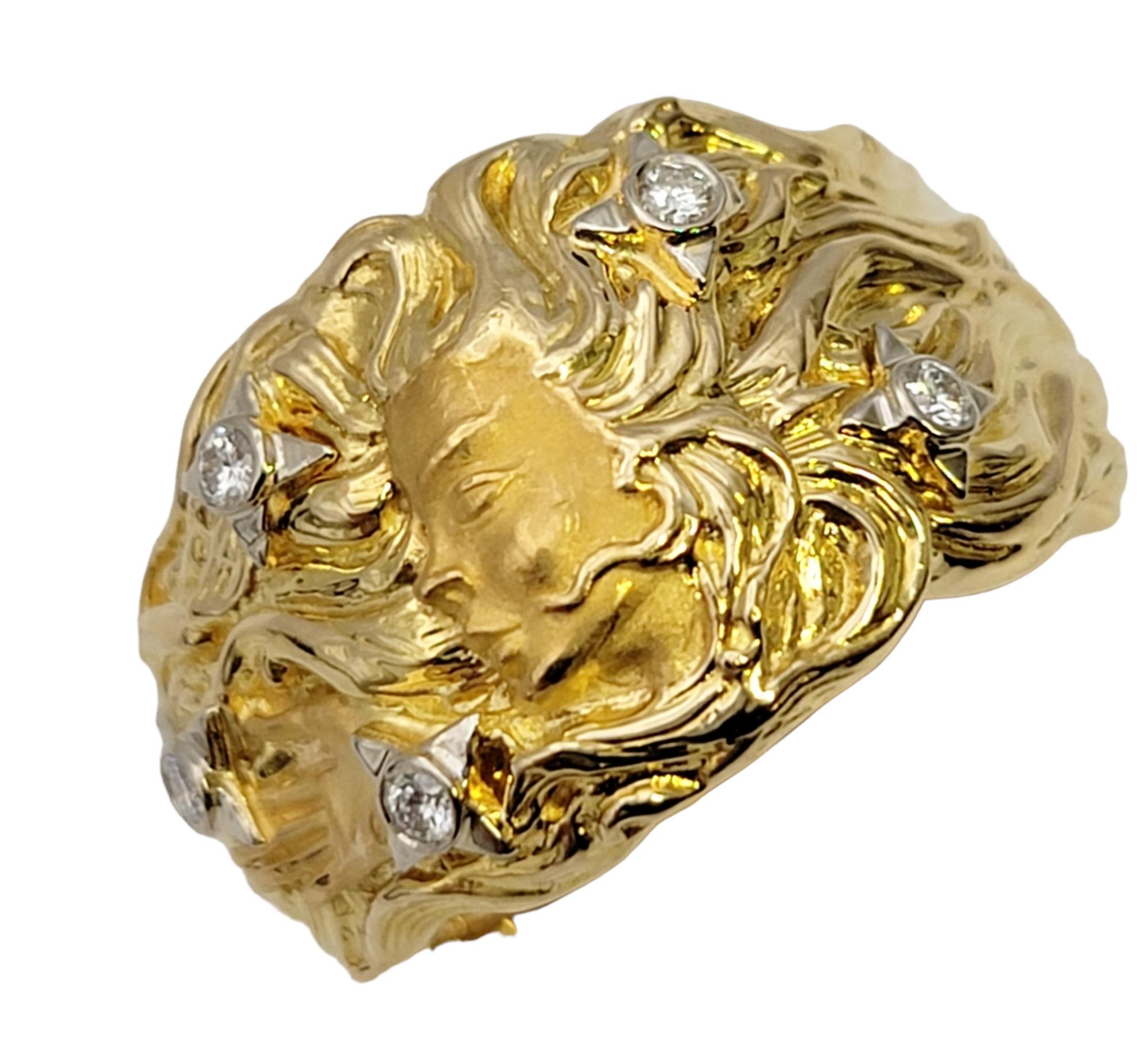 Ring size: 4.5

Intricately designed 18 karat yellow gold band ring by Carrera y Carrera. The detailed piece features a raised profile of a woman (Venus) with flowing hair accented with 5 bezel set diamonds. It has a nice blend of polished and