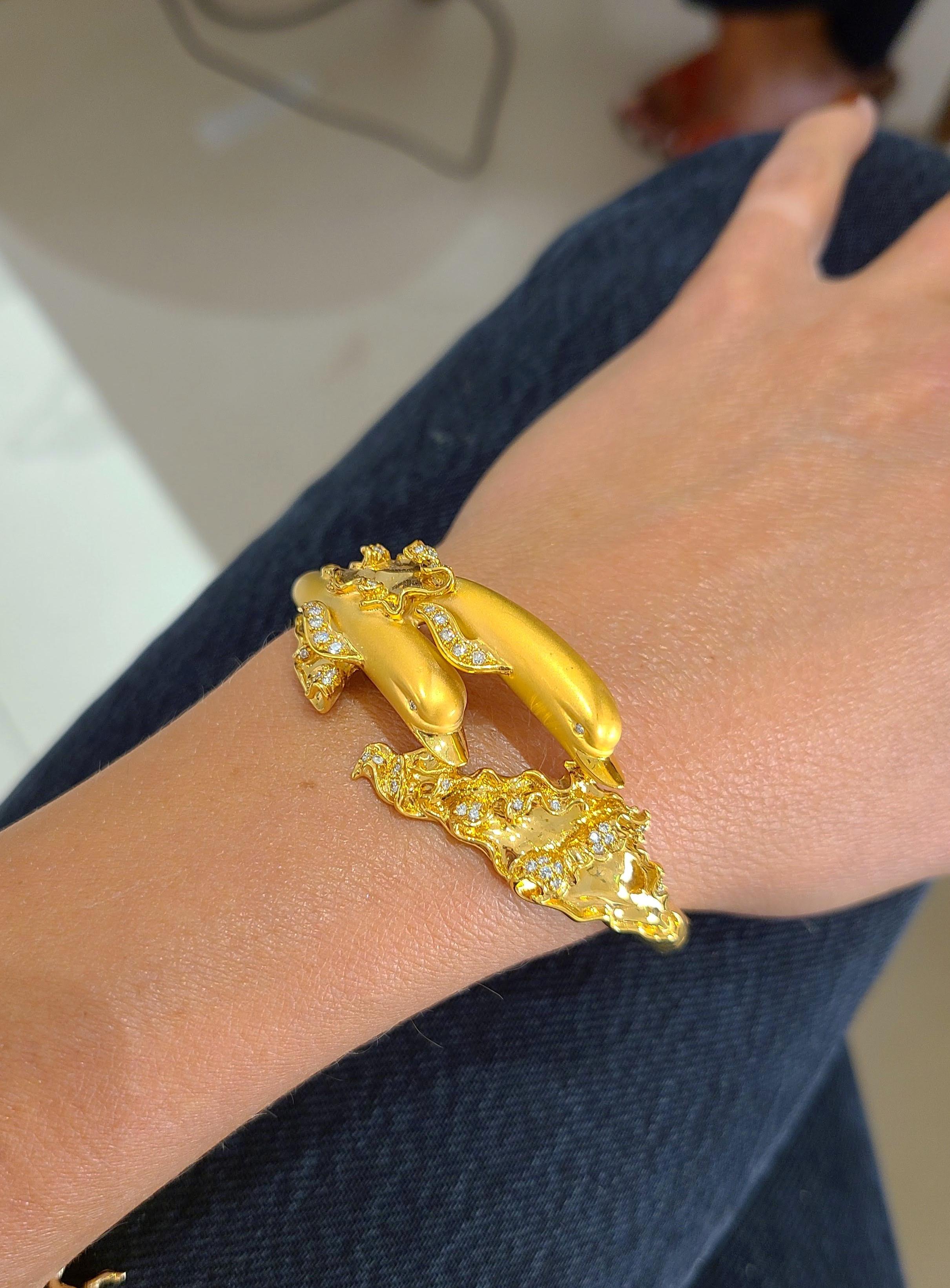 Carrera Y Carrera has built its famous name on figurative designs, an obsession with surface finishes, and a compelling way of seeing beauty in art and nature. This 18 karat yellow gold bangle/cuff bracelet is a perfect example of Carrera's iconic