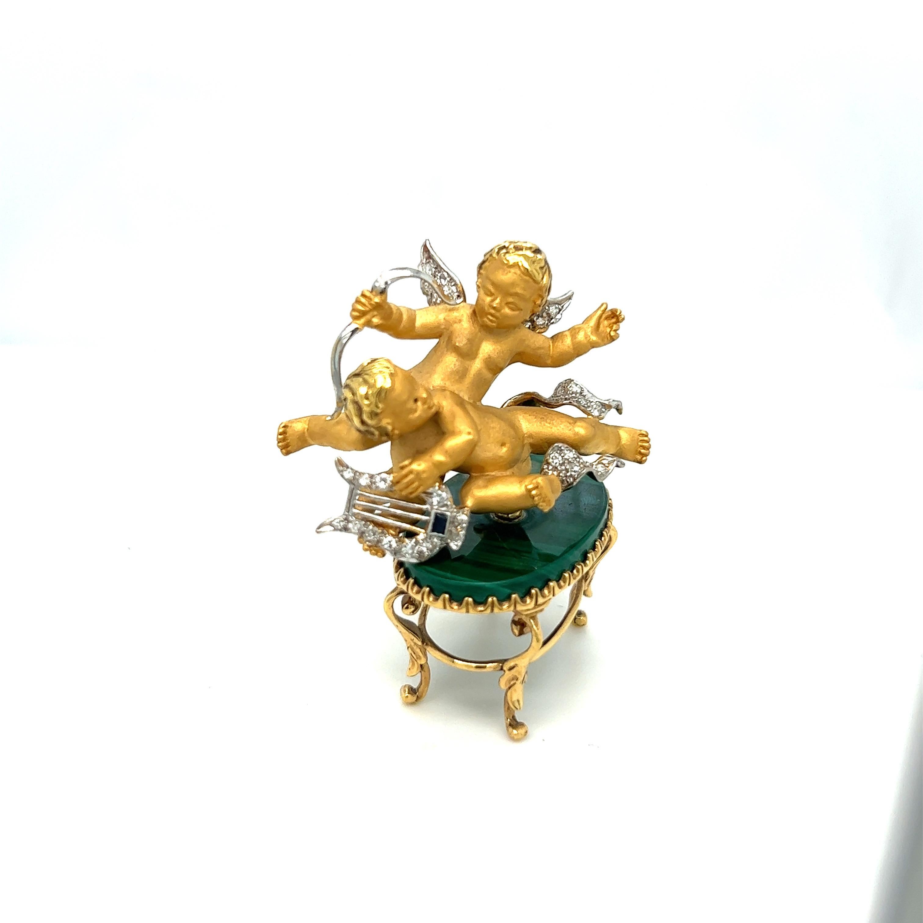 Carrera Y Carrera has built its famous name on figurative designs, an obsession with surface finishes, and a compelling way of seeing beauty in art and nature. 
This magnificent 18 karat gold pendant is designed with twin 3 dimensional cherubs.