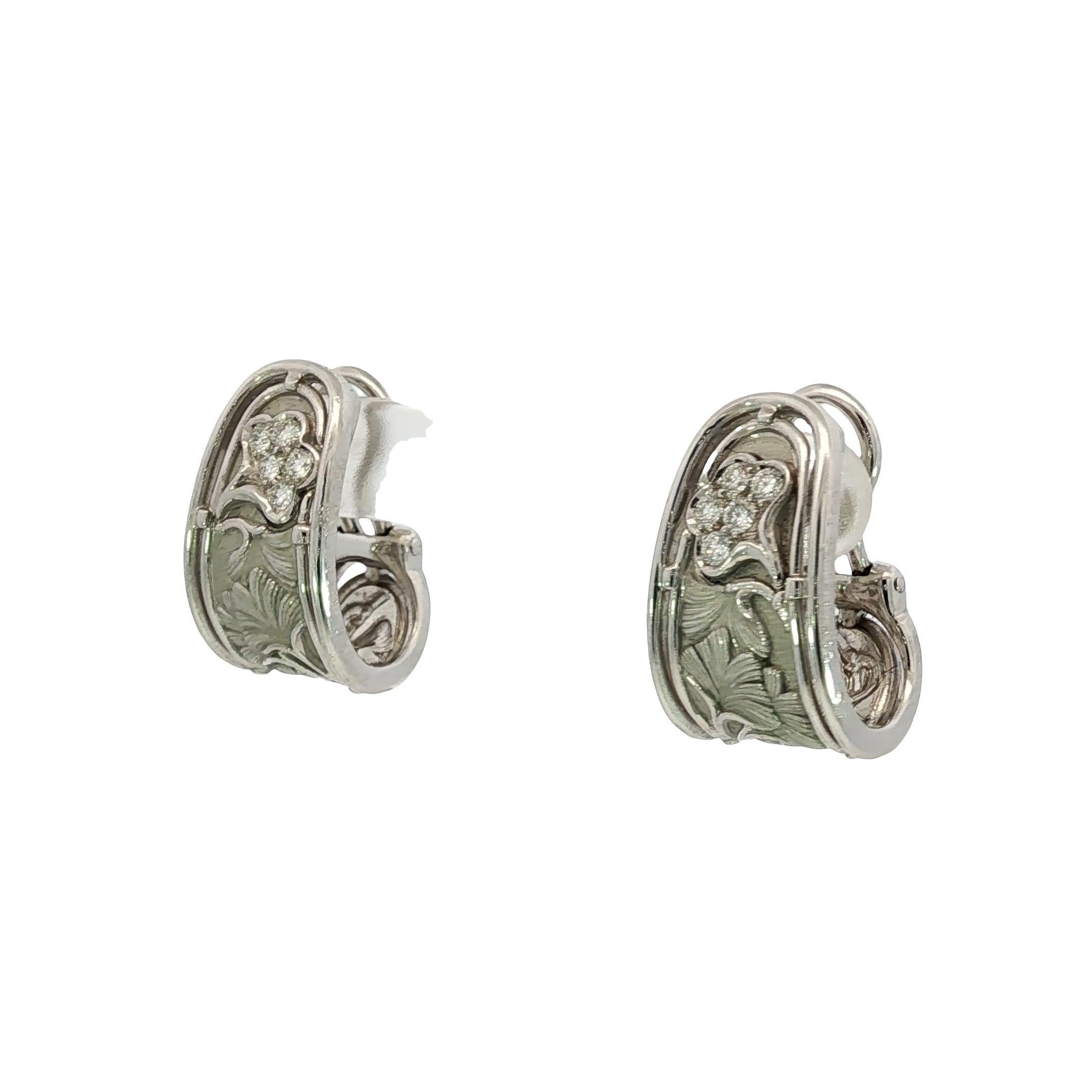 Carrera y Carrera 18K Gold Diamond Earrings Floral Motif Clip On Closure

These 18k white gold clip-on earrings by Carrera y Carrera feature a delicate floral motif set with round white diamonds. Intricately engraved leaf patterns add depth and