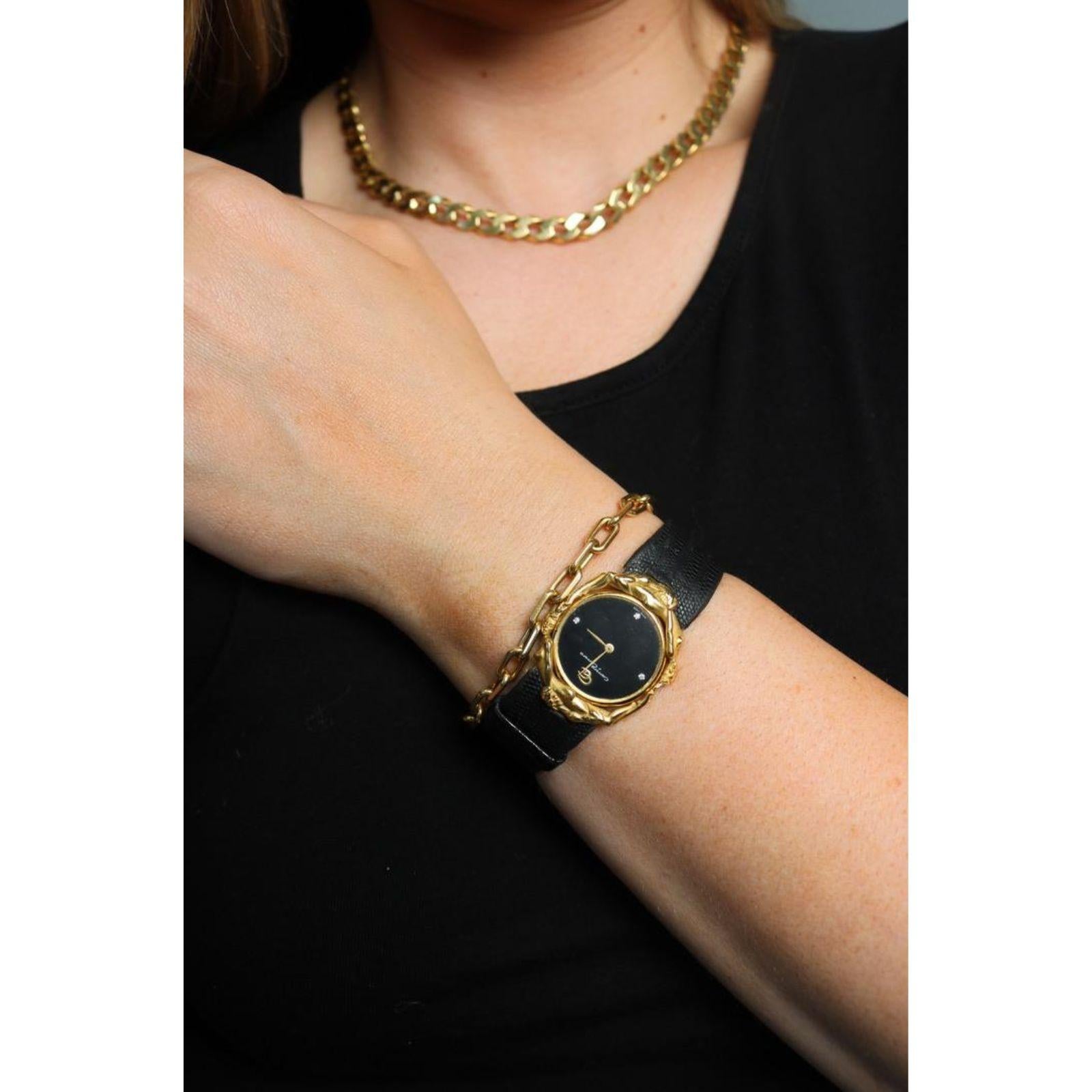 Carrera y Carrera 18K Uhr Adam und Eva Figural Quarz Uhrwerk 18K Gelbgold

Die Carrera y Carrera Figural Watch - Adam and Eve zeichnet sich durch ein asymmetrisches Design aus, das sich um ein kühnes schwarzes Zifferblatt dreht, das von einer