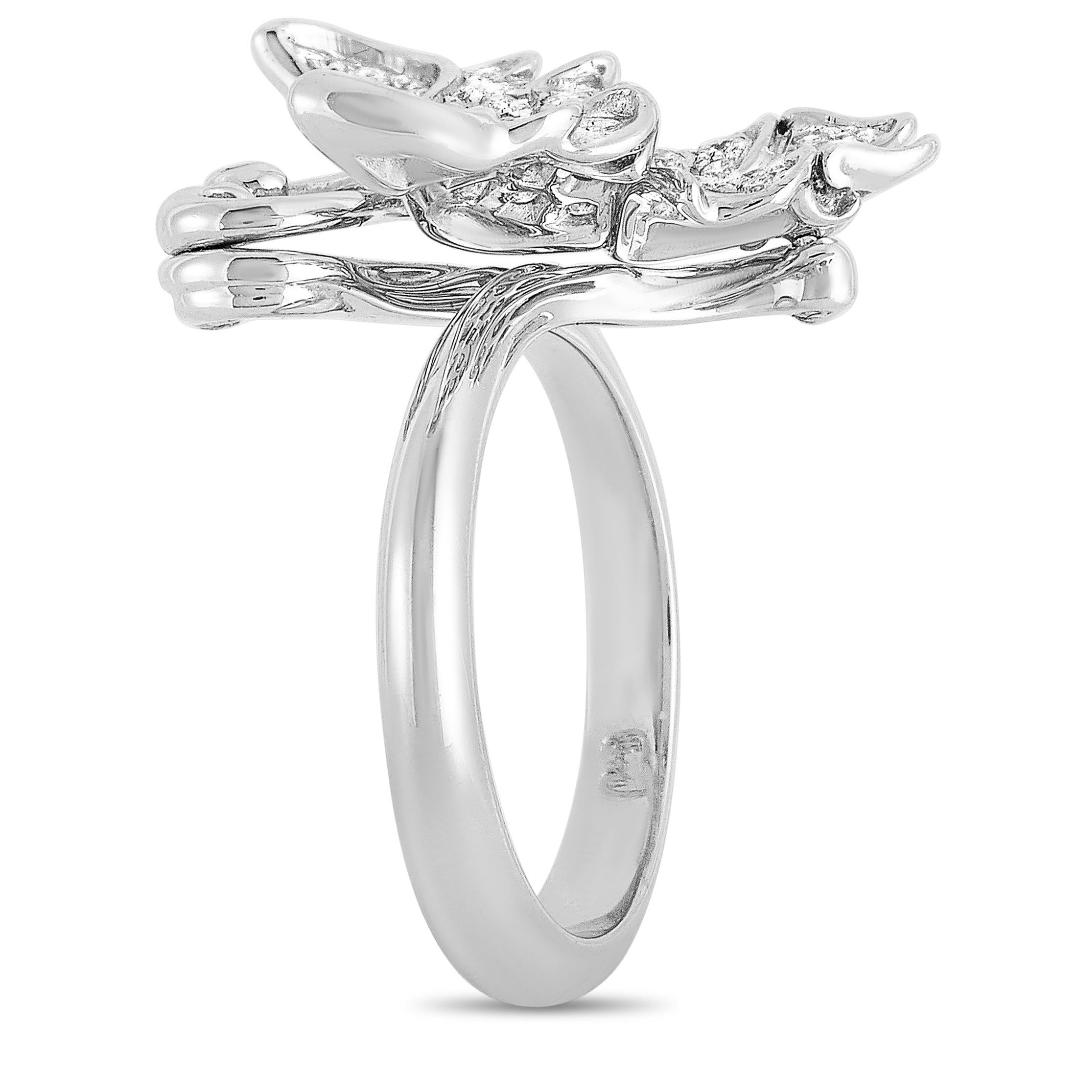 This Carrera y Carrera butterfly ring is crafted from 18K white gold and embellished with diamonds that amount to 0.37 carats. The ring weighs 8.7 grams, boasting band thickness of 3 mm and top height of 8 mm, while top dimensions measure 26 by 23