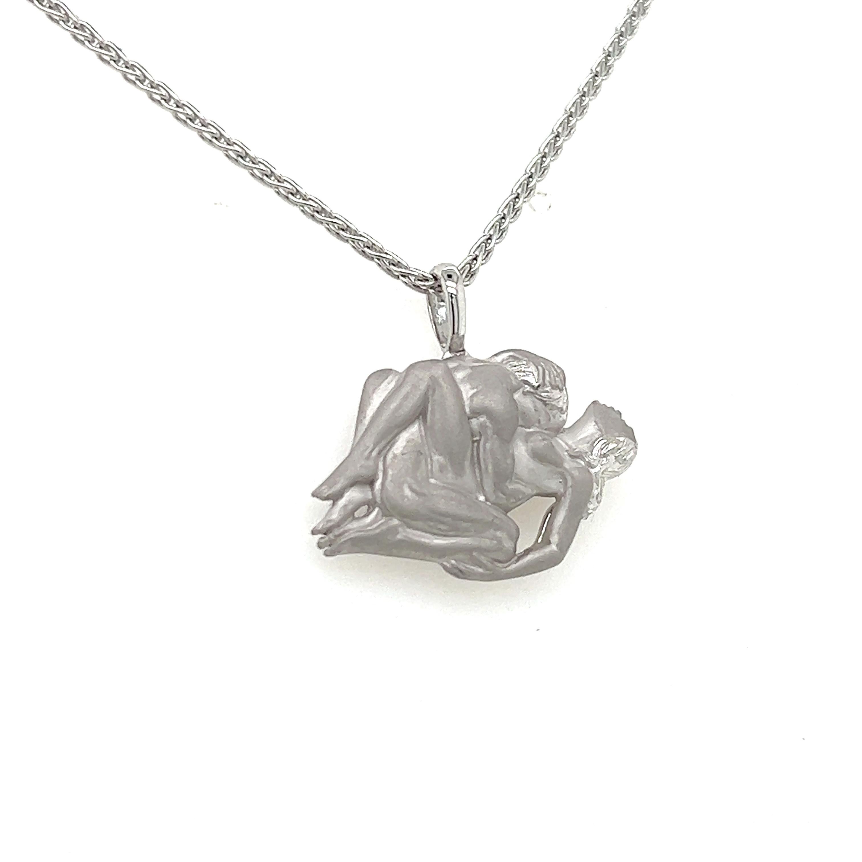 Beautiful erotic necklace crafted by famed designer Carrera Y Carrera. The necklace is crafted in 18k white gold and depicts a love scene between a man and woman.
The design shows Carrera Y Carrera's artistic touch as both  satin and high polish