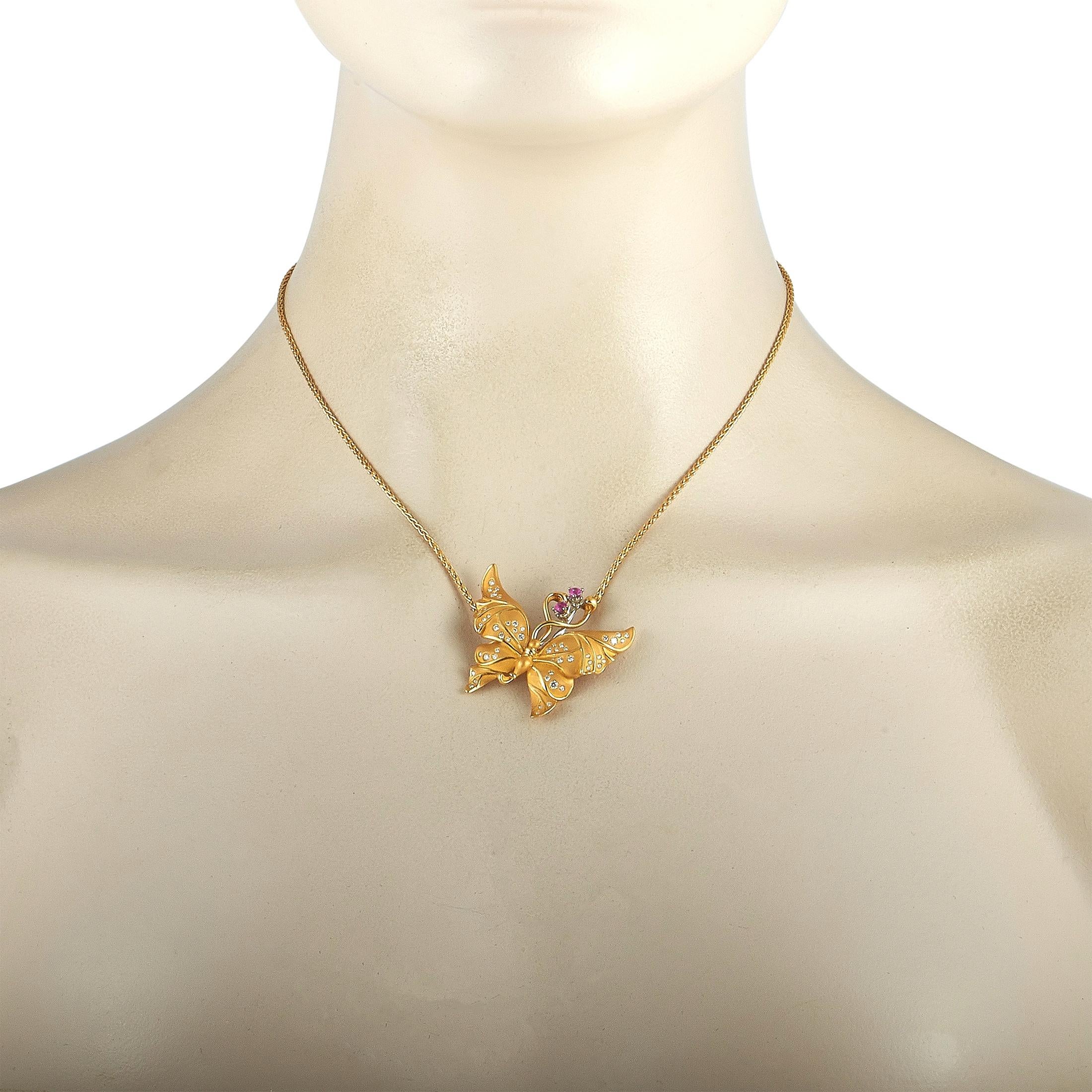 This Carrera y Carrera necklace is made of 18K yellow gold and embellished with diamonds and sapphires that total 0.50 and 0.40 carats respectively. The necklace weighs 16.5 grams and is presented with a 16” chain, boasting a butterfly pendant that