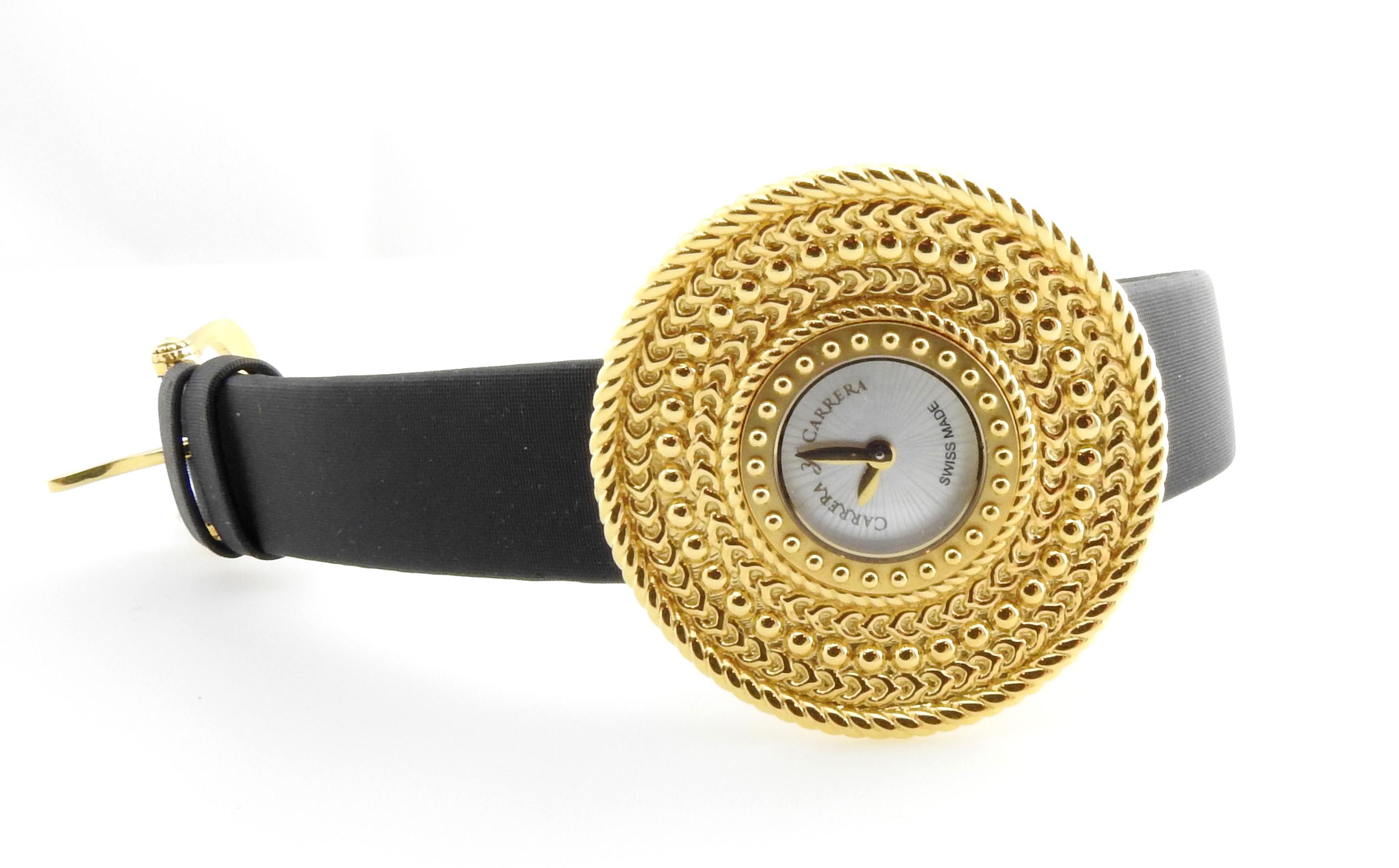 Carrera Y Carrera 18K Yellow Gold Abstract Circle Beaded Ladies Watch

Mother of Pearl Dial marked Carrera Y Carrera Swiss Made

Dial is approx. 35.5 mm in diameter and 8.75mm thick

Model # 1000/00070

Watch still has tag on 

Quartz