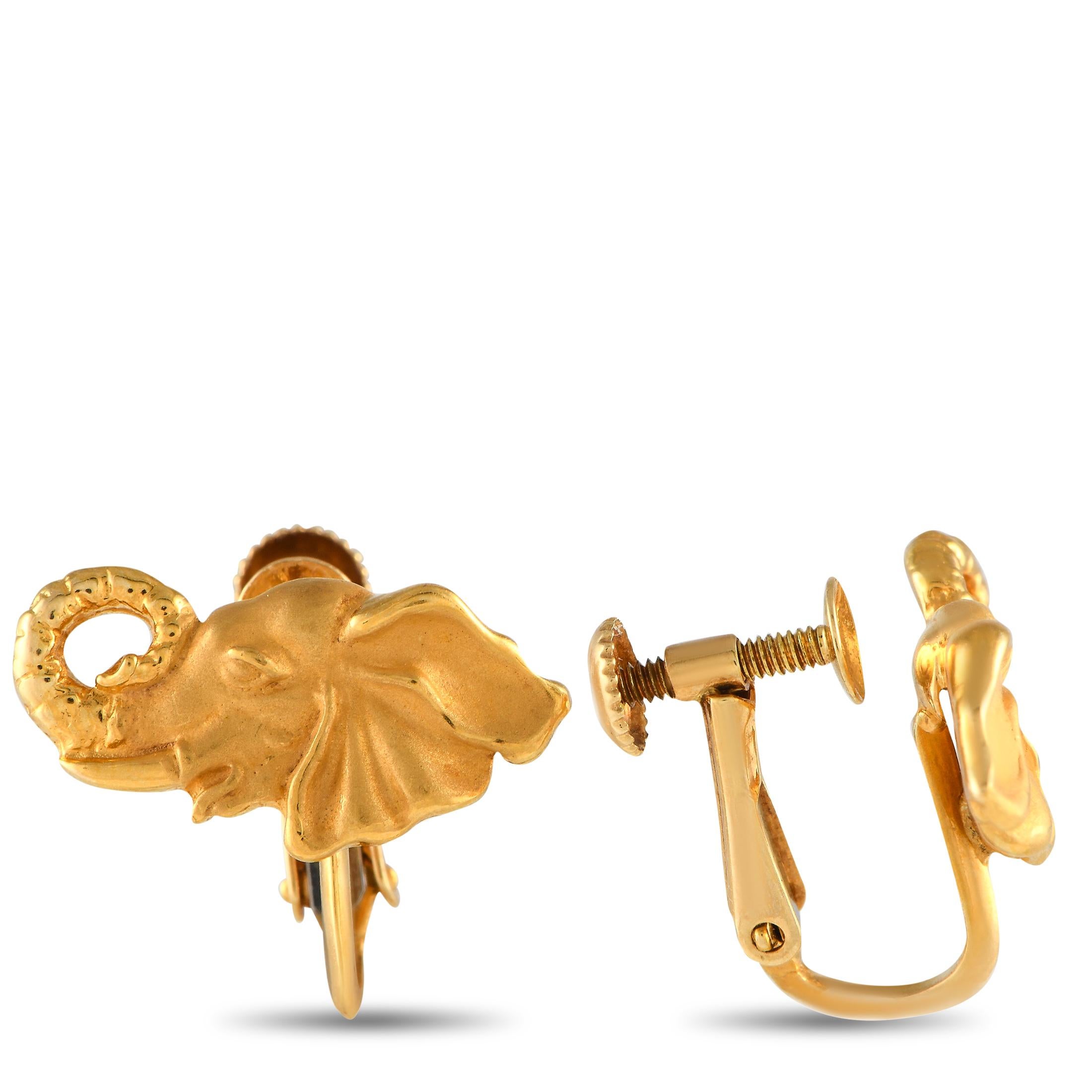 These Carrera y Carrera earrings are steeped in old world elegance. Crafted from opulent 18K yellow gold, each one features an intricate elephant motif design. Each earring measures 0.65” long, 0.50” wide, and is secured to the ear with a screw-back