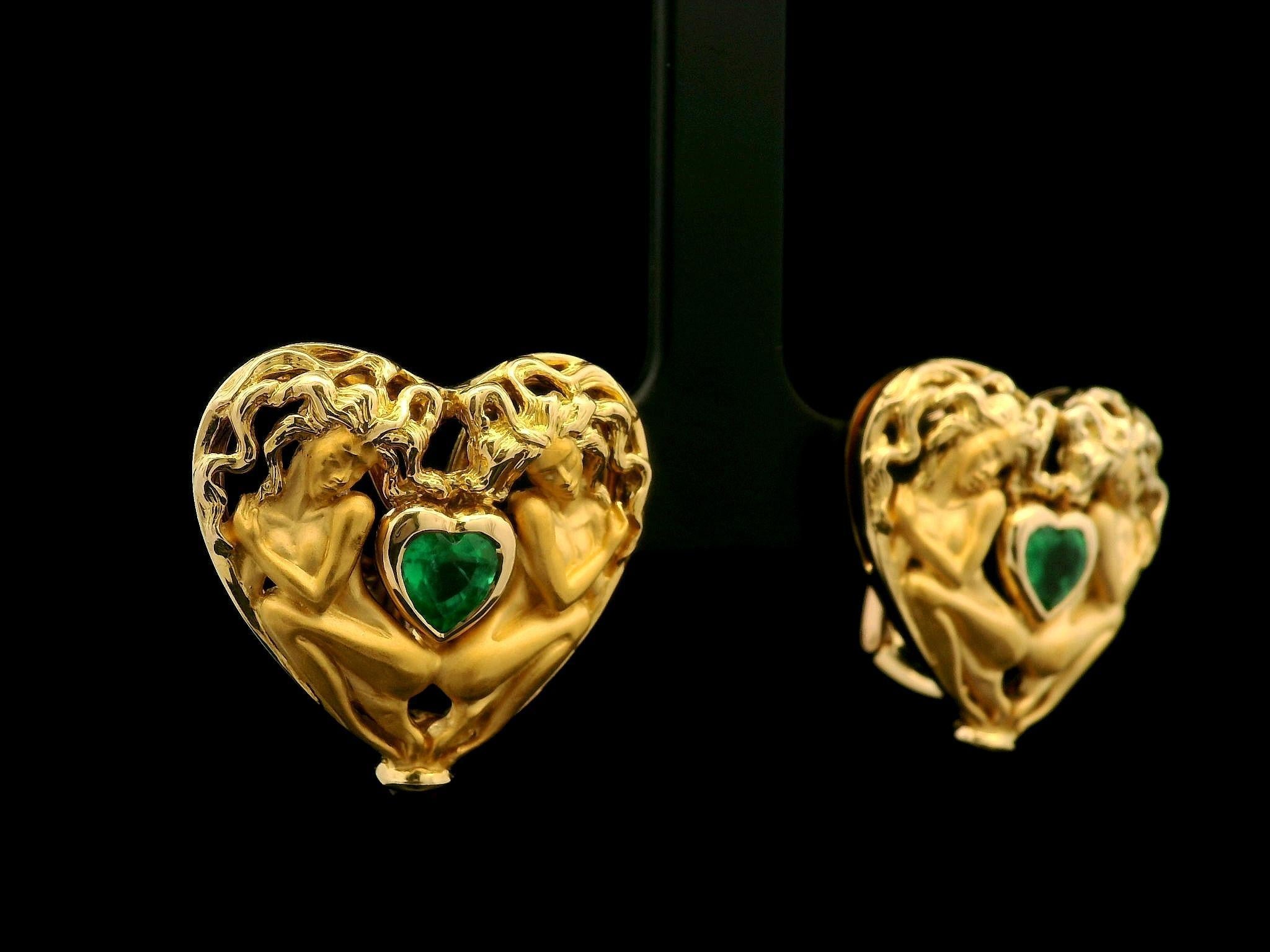 --Stone(s):--
(2) Natural Genuine Emeralds - Heart Brilliant - Bezel Set - Vivid Green Color - 4.6x5mm - 0.80ctw (approx.)
(2) Natural Genuine Ruby - Round Cabochon Cut - Bezel Set - Deep Red Color - 2.6mm (approx.)

Material: Solid 18K Yellow Gold