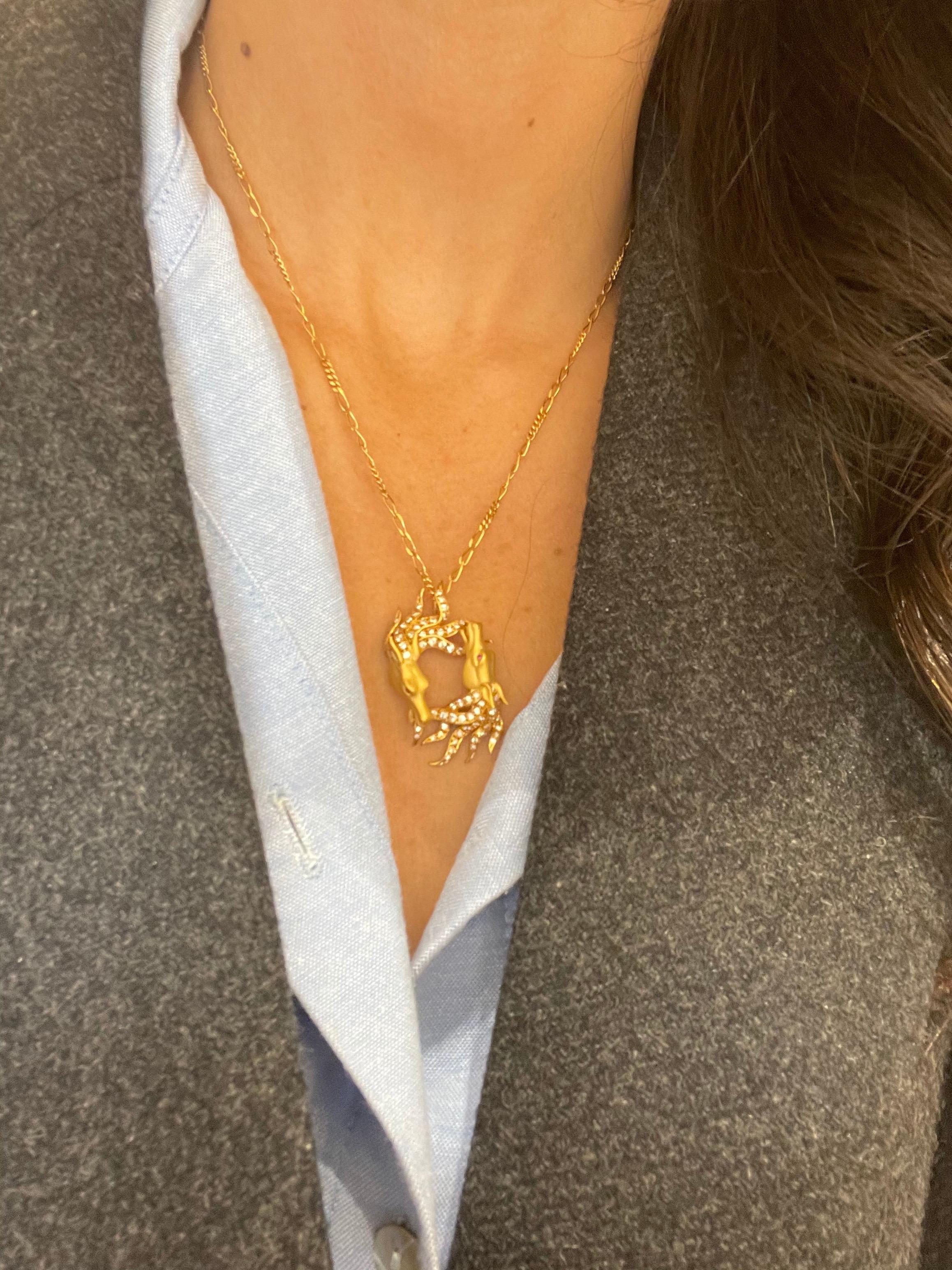 Carrera Y Carrera has built its famous name on figurative designs, an obsession with surface finishes, and a compelling way of seeing beauty in art and nature. This 18 karat yellow gold and diamond pendant is a perfect example of Carrera's iconic