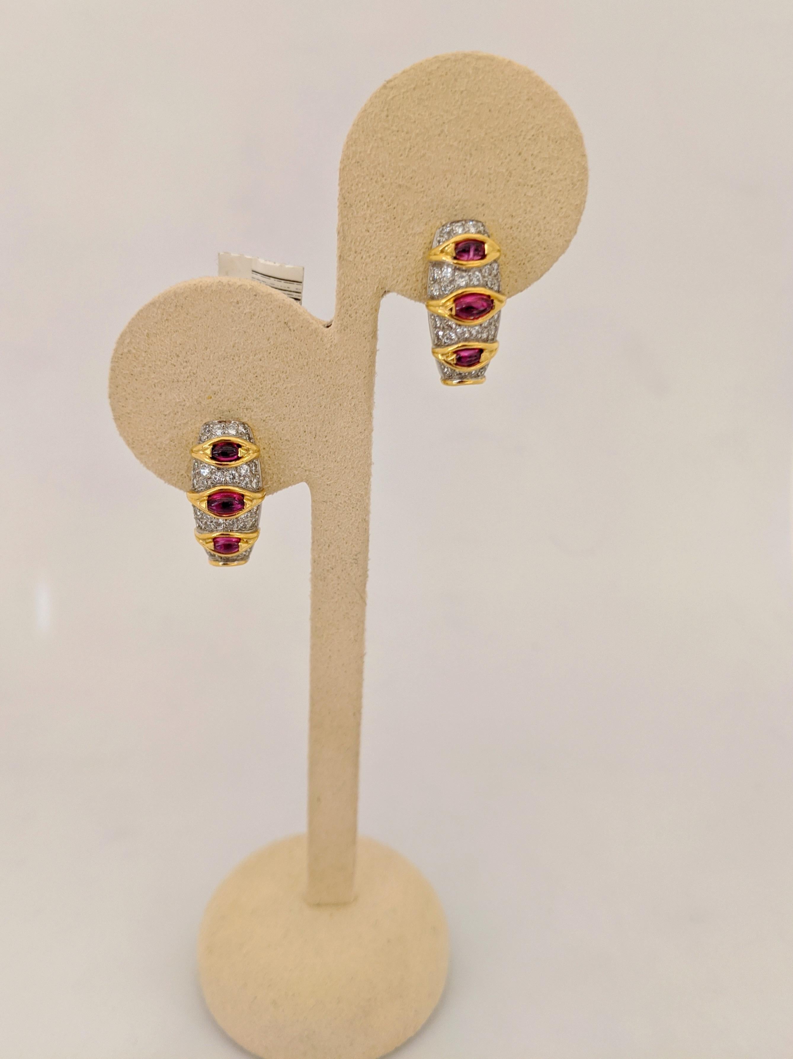 A beautiful pair of vintage 18 karat yellow gold earrings designed by Carrera Y Carrera for Cellini Jewelers NYC. These earrings features 3 marquis shaped cabachon Rubies and round brilliant pave set Diamonds. The earrings are pierced with a post