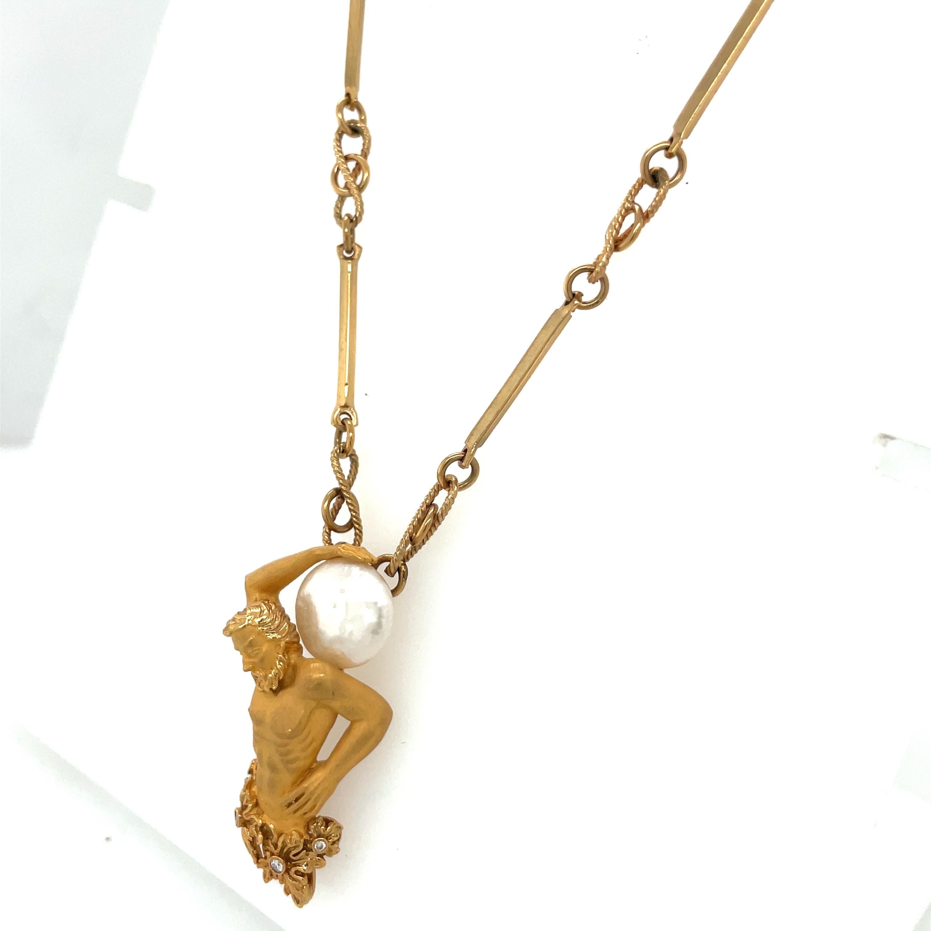 This 18 karat yellow gold pendant by Carrera Y Carrera of Spain depicts a beautifully detailed Atlas, the Titan who was responsible for bearing the weight of the heavens on his shoulders. He is crafted in a sandblasted 18 karat yellow gold finish.