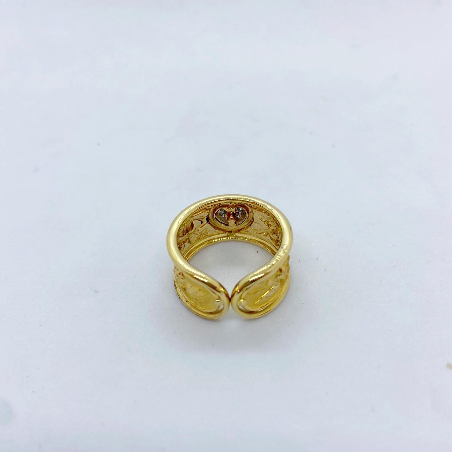 Round Cut Carrera y Carrera 18 Karat Yellow Gold Band with Angels and Diamond Heart Center