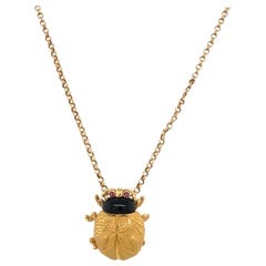 Retro Carrera Y Carrera 18KT Yellow Gold Scarab Pendant with Onyx and Rubies