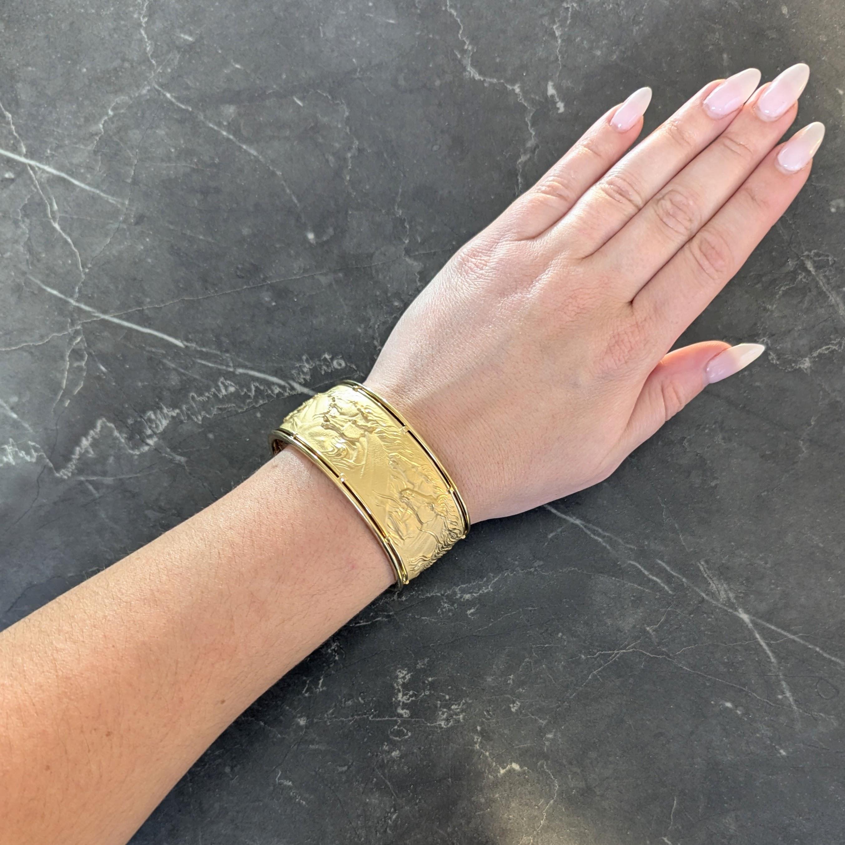 Centering a matte gold repoussé panel depicting wild horses
Set with high polished gold wire frame surround
With rounded open terminals
Stamped for 18 karat gold
Numbered with maker's mark for Carrera y Carrera
Circa: 1980's
Bracelet size: 6 1/4