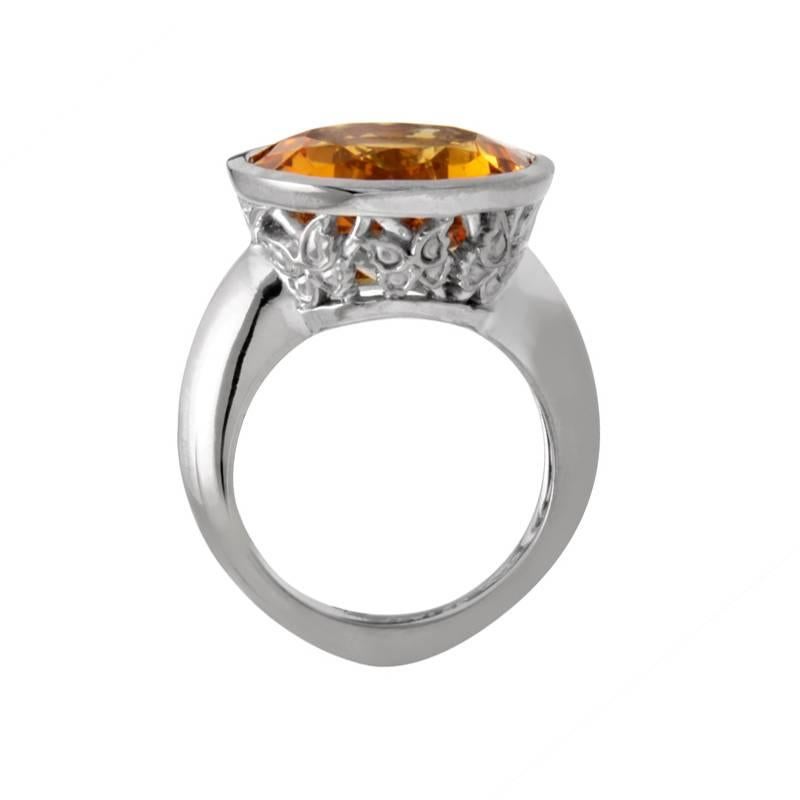 With a bit of a medieval feel to it, this ring will make you feel like royalty, with its perfectly cut citrine fit craftily into the top of the 18K white gold body and remarkable metal decorations around and underneath the stone.

Size: 6.25