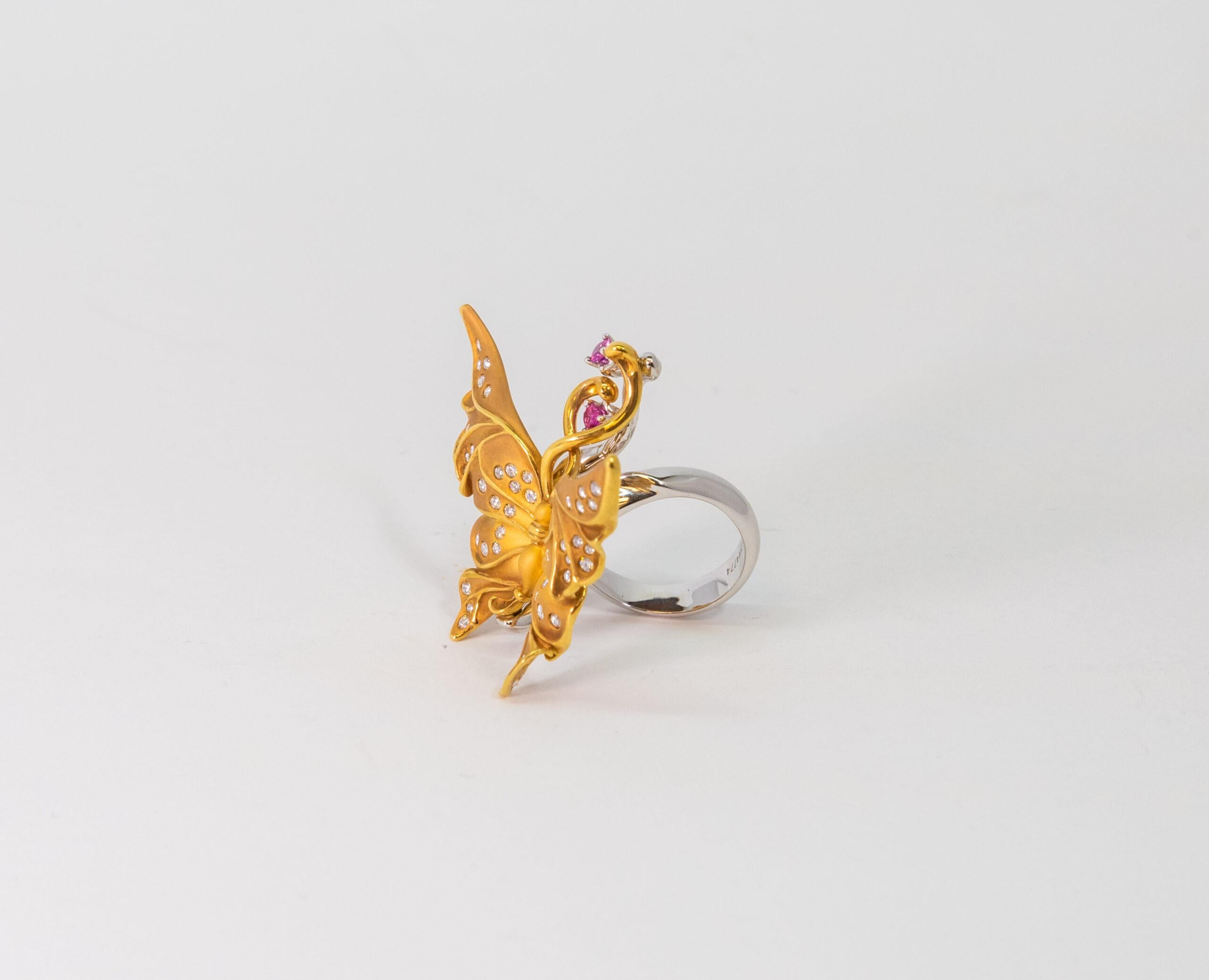 This Butterfly shape ring is made of 18K Yellow Gold and 18K White Gold. The butterfly-shaped front of the ring is decorated with 52 Diamonds (~0.72ct) and 2 Pink Sapphires (~0.22 ct).

Size – 55 (7 US)