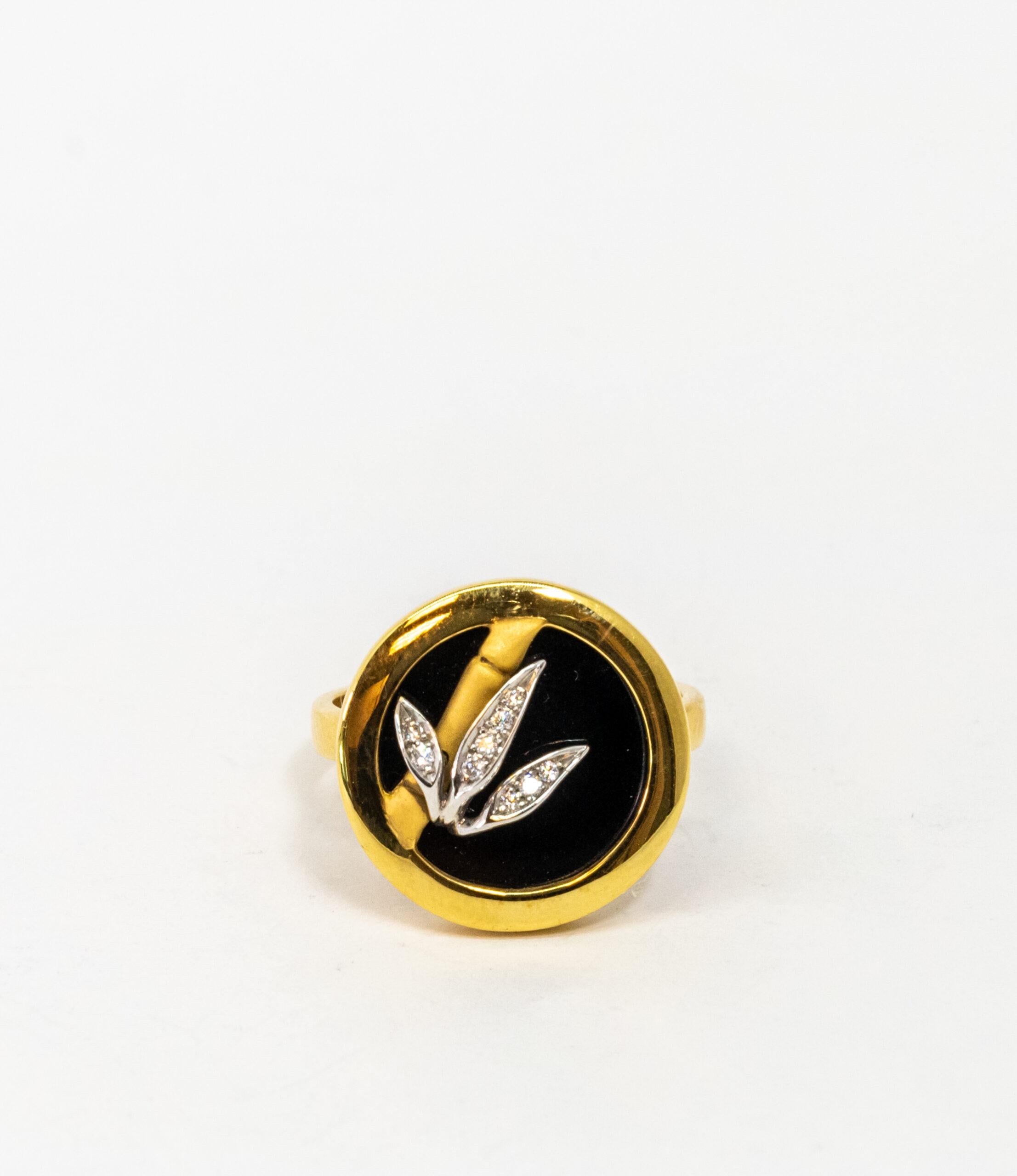 This ring is made of 18K Yellow Gold. It is decorated with black Onyx base and 18K Yellow gold bamboo stick with leaves. 18K White Gold leave patterns set with 9 Diamonds (~0.06 ct)

Size – 54.5 (7 US)