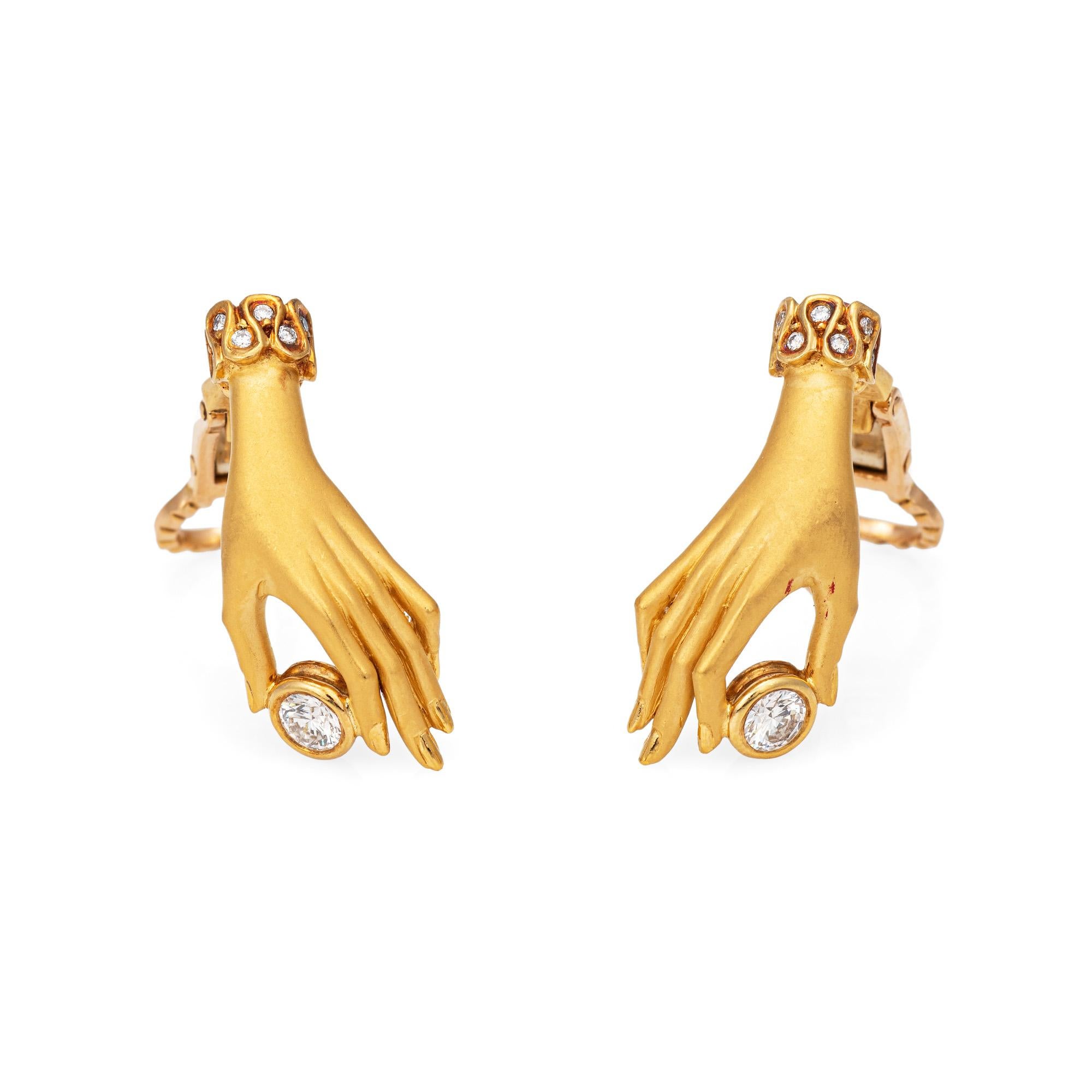 Estate Carrera y Carrera diamond hand earrings crafted in 18 karat yellow gold (circa 2008).  

Diamonds total an estimated 0.35 carats (estimated at H-I color and VS2-SI1 clarity)

The beautifully detailed earrings highlight elegant hands in matte