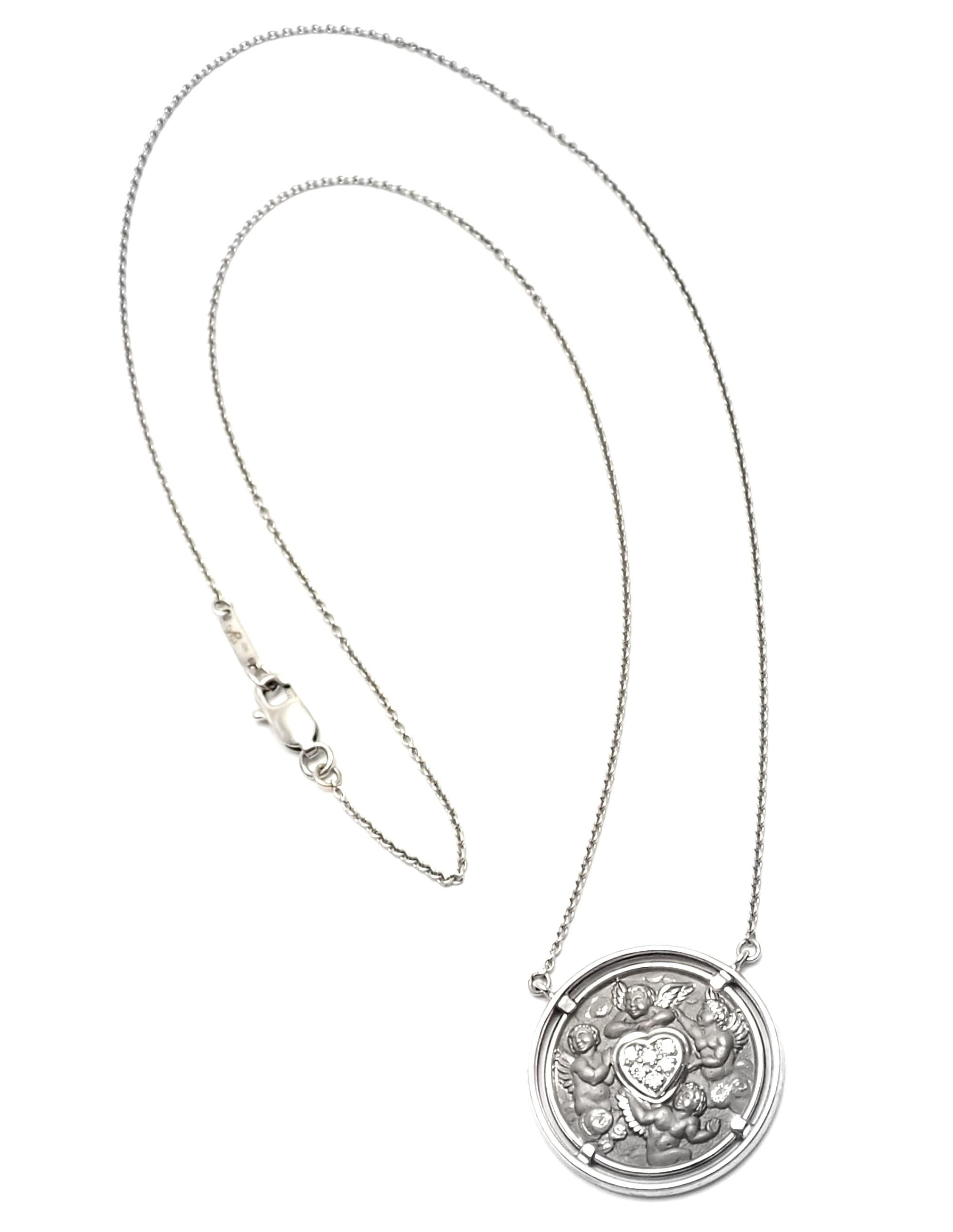 18k White Gold Diamond Heart Angel Pendant Necklace by Carrera Y Carrera.
With 6 round brilliant cut diamonds VS1 clarity G color 
total weight .06ct
This necklace comes with a Box.
Details:
Length: 19