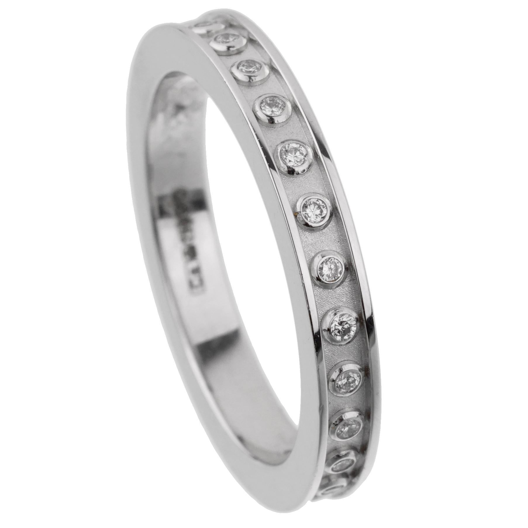 A chic diamond ring by Carrera Y Carrera showcasing round brilliant cut diamonds encircling the entire band. The ring measures a size 7 and has a total weight of .18ct of the finest diamonds.