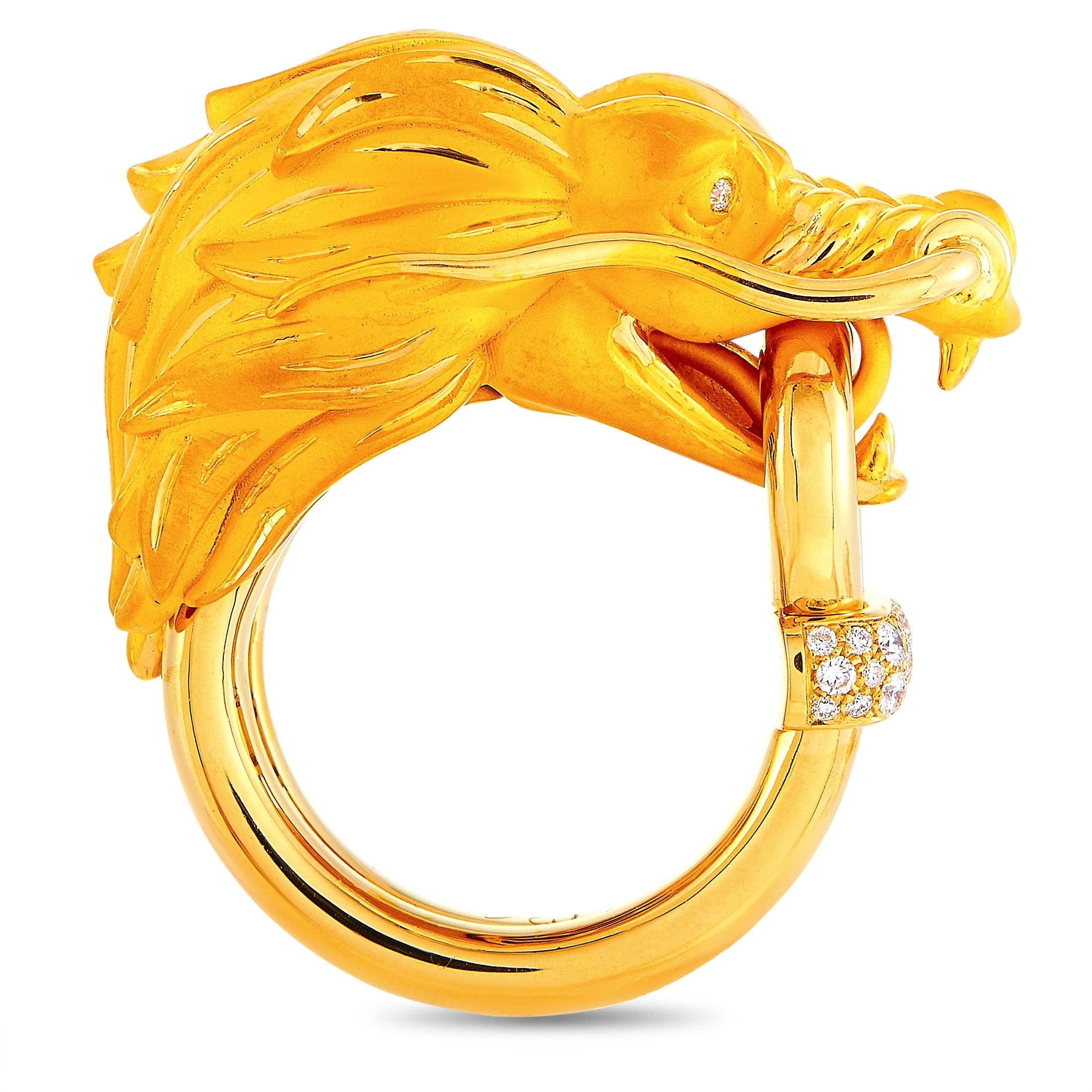 The Carrera y Carrera “Dragon's Secret XL” ring is made of 18K yellow gold and embellished with diamonds that amount to 0.18 carats. The ring weighs 18.2 grams and boasts band thickness of 5 mm and top height of 10 mm, while top dimensions measure