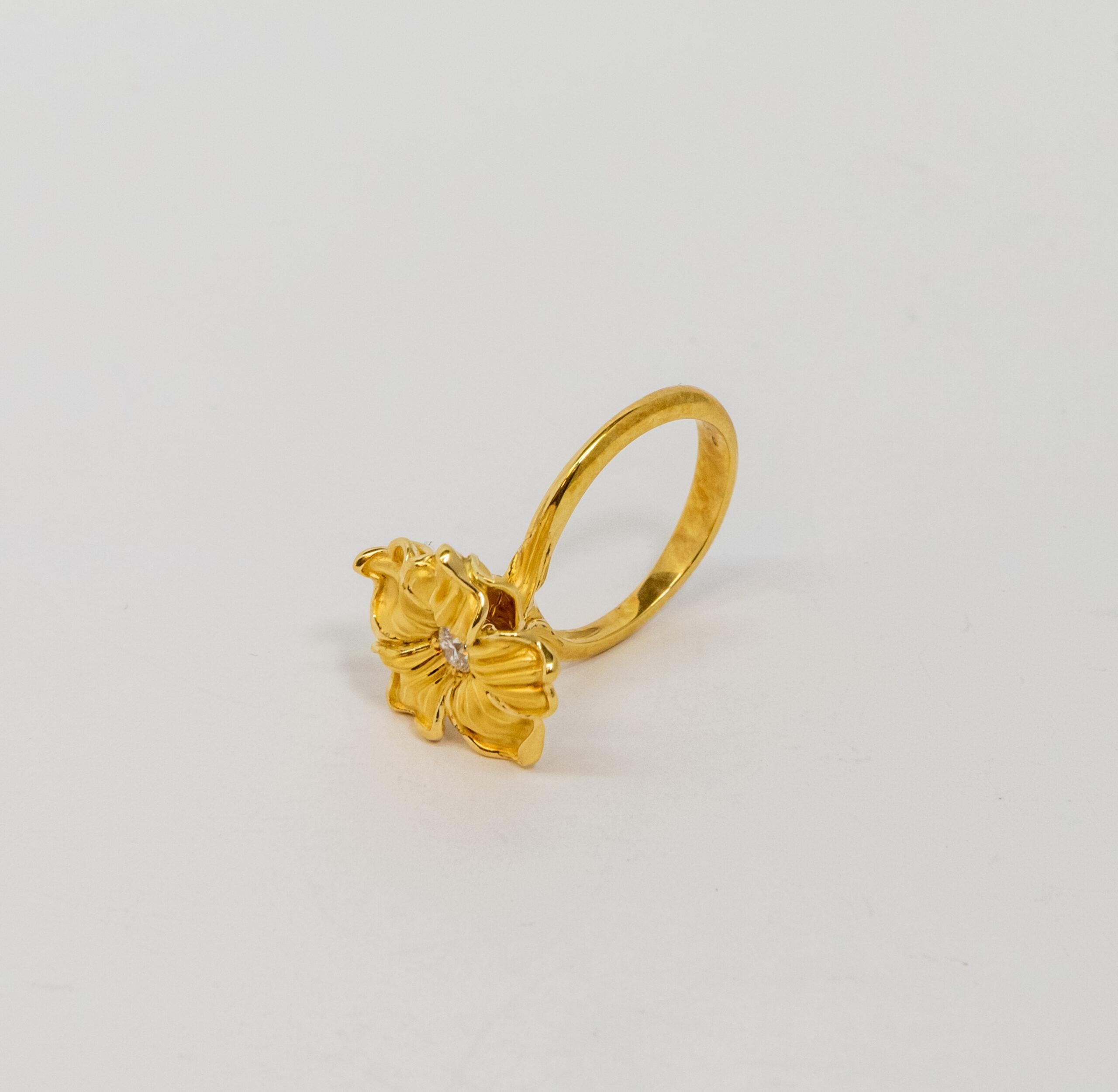 This ring is made of 18K Yellow Gold. It is decorated with 18K Yellow Gold flower with a diamond (~0.19ct)

Size – 56 (7.5 US), 53 (6.5 US)
