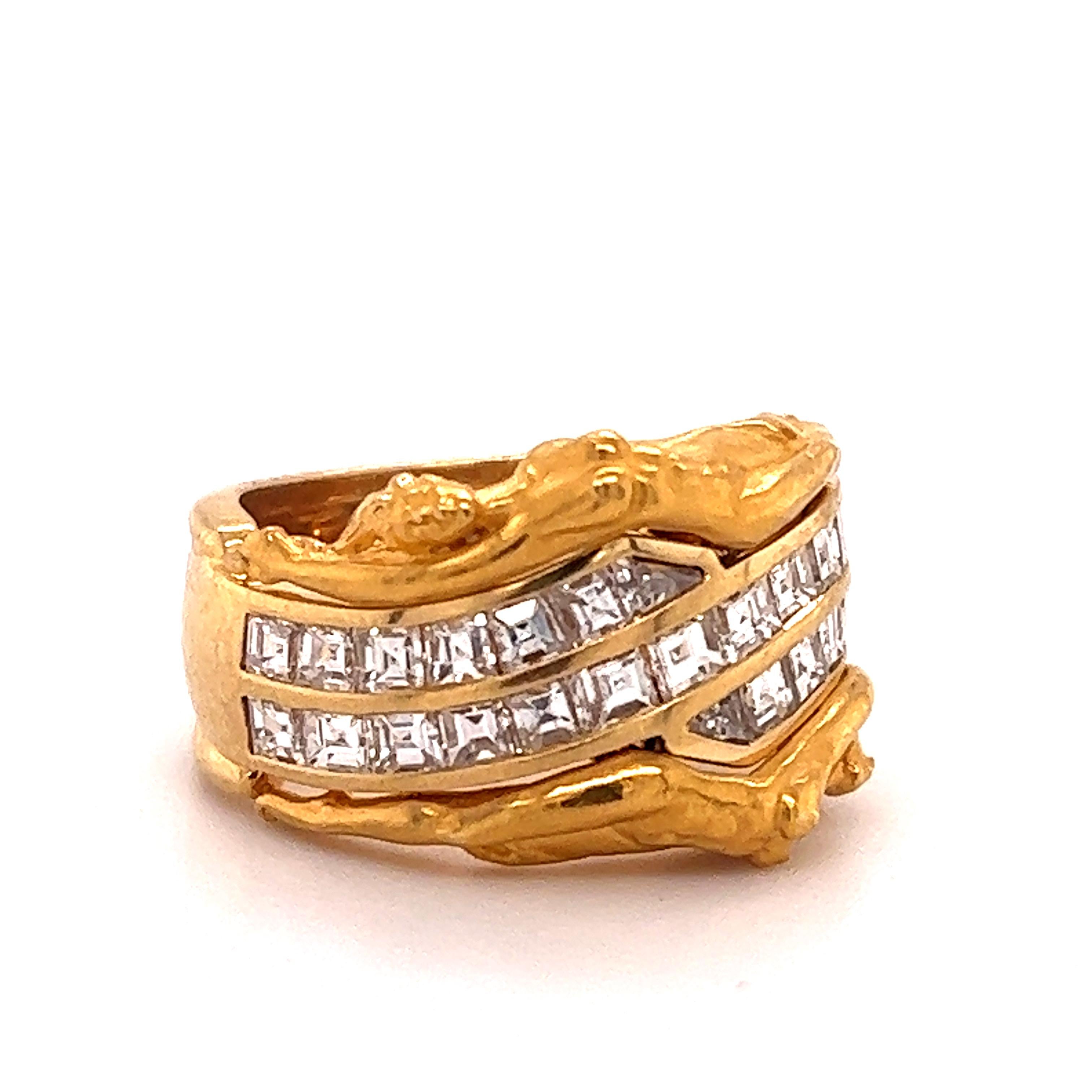        Gorgeous design crafted by famed designer Carrera y Carrera. The ring is crafted in 18k yellow gold and highlights an erotic theme as two naked ladies lay across the top and bottom of the design.
         The ring is a wide band design as it