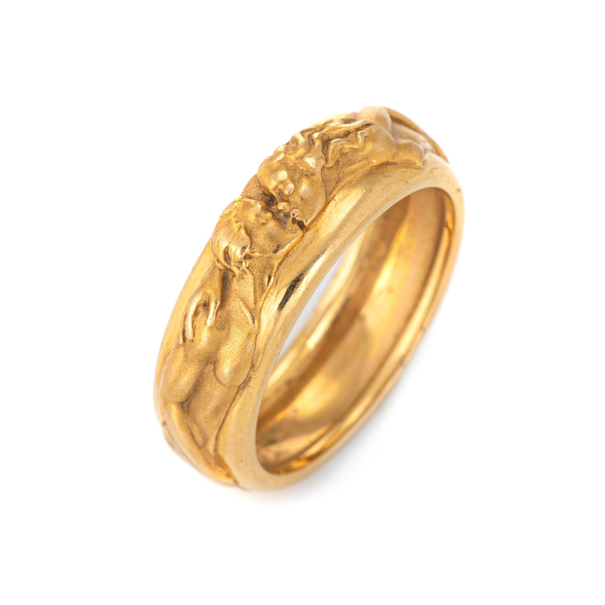 Finely detailed Carrera y Carrera Promesa ring (circa 2014) crafted in 14 karat yellow gold. 

The beautifully detailed ring features a man and woman enveloped around the band in matte gold, coming together to kiss. The ring is from the 'Promesa'