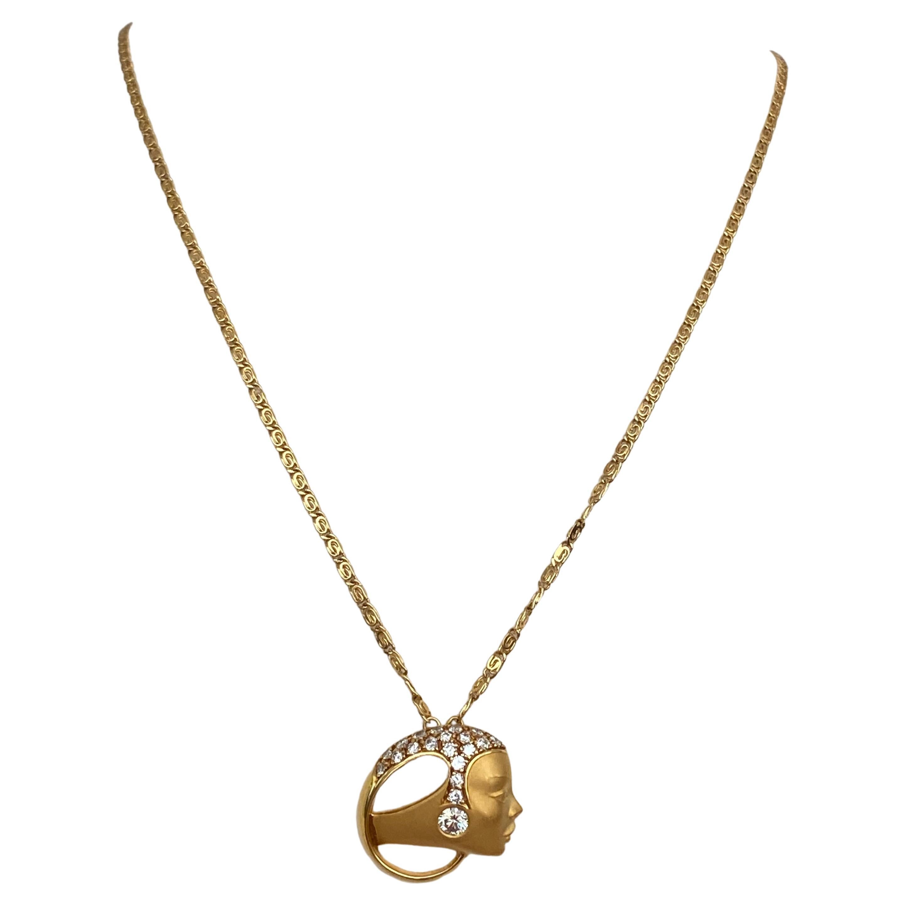Offered  18 kt yellow gold Necklace by brand Carrera y Carrera. Lady Head pendant is decorated with 18 pieces of brilliant cut diamonds approx. 0.36crt G/VS/SI and one of brilliant cut diamond approx. 0.20  crt G/VS. Totally: 0.56 crt.  The necklace