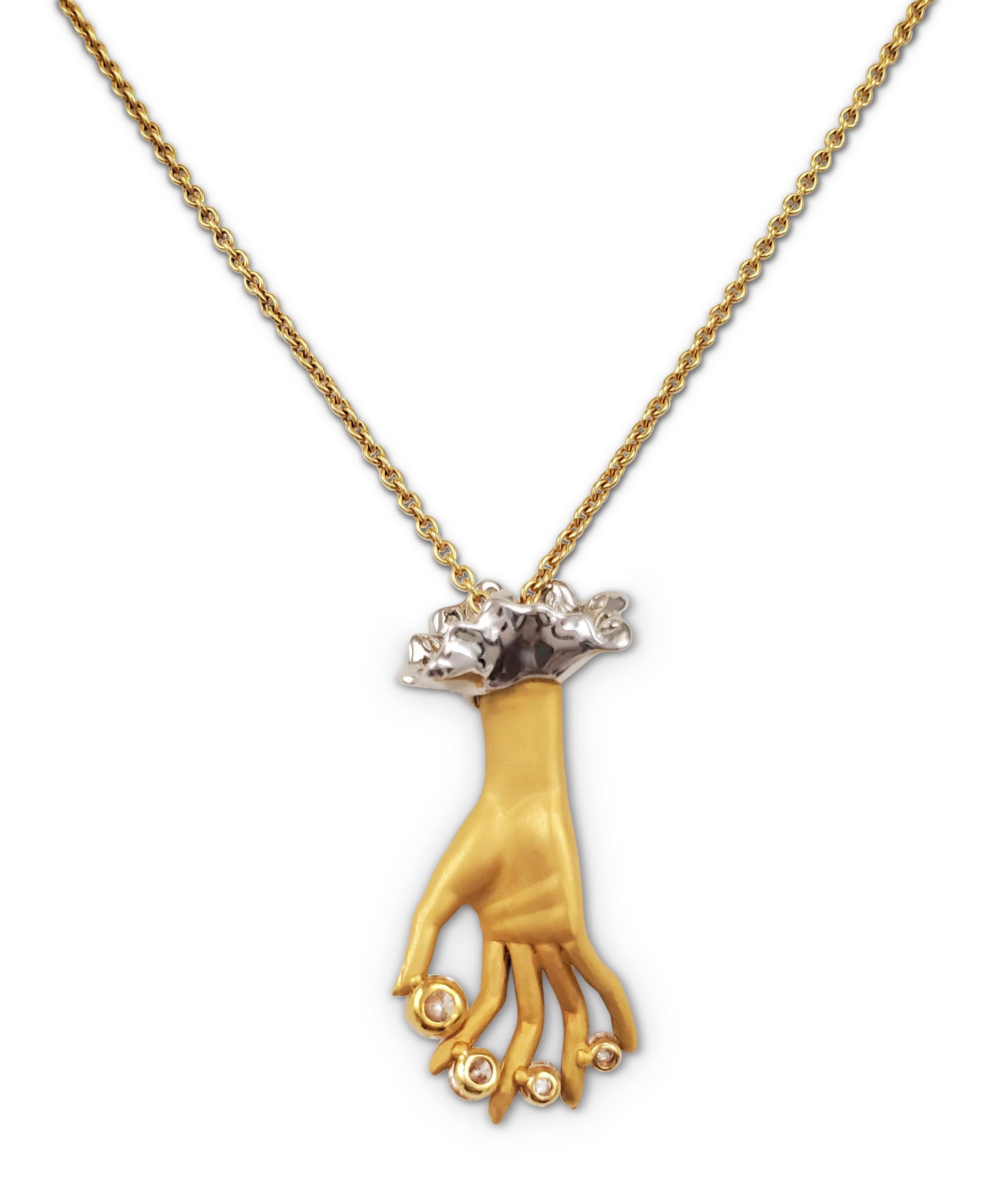 Authentic Carrera y Carrera 'Las Manos' pendant designed as a hand accented with round brilliant cut diamonds weighing an estimated 0.95 carats (E-F color, VS clarity). The pendant hangs from an 18 karat yellow gold chain that measures 16 inches in
