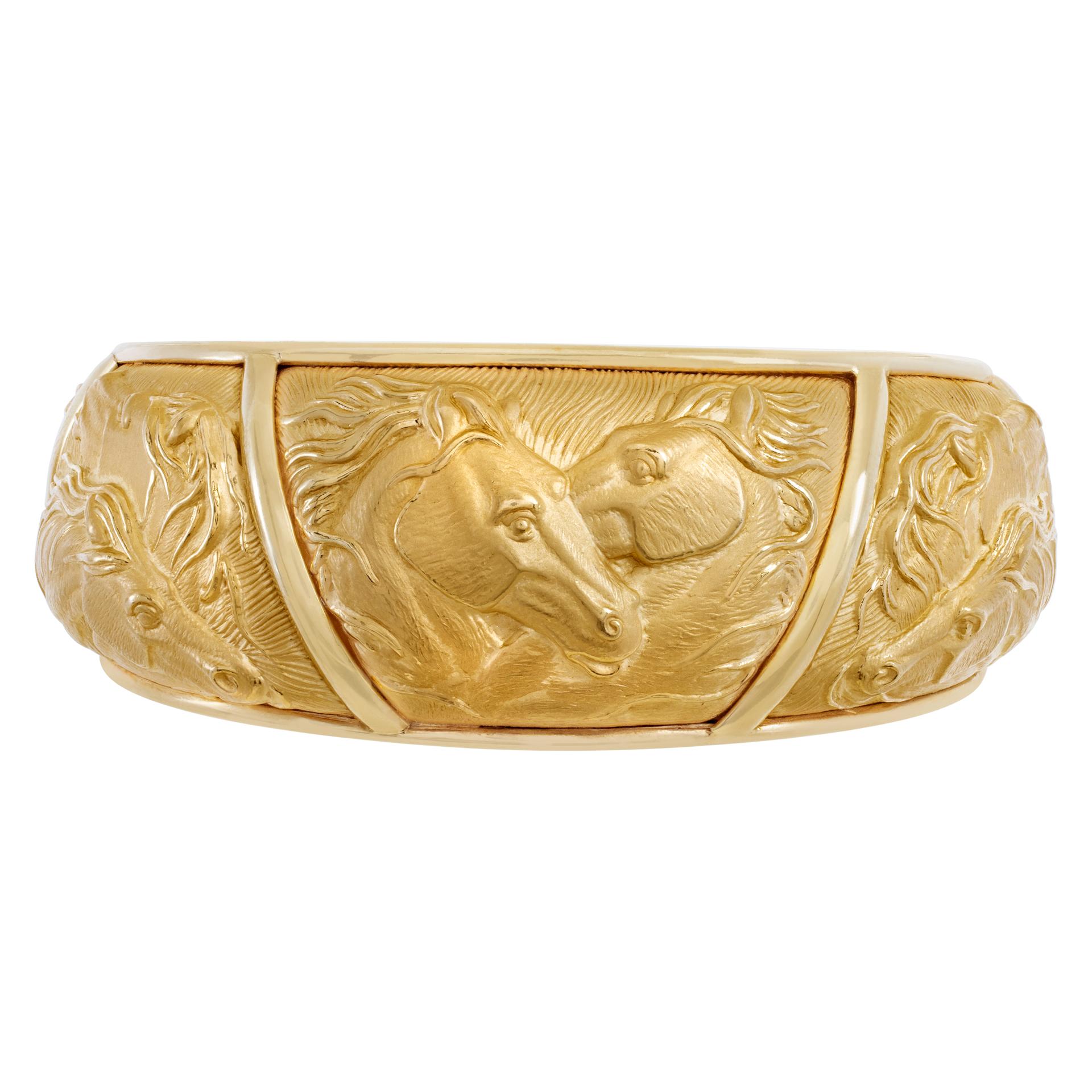 Spanish designer Carrera y Carrera, from the Mosaico collection, cuff- bangle with horse heads in 18k. Crafted using the repousse technique featuring horses in a sandblasted finish accented with high polished sections.FIts up to 7.50 wrist.