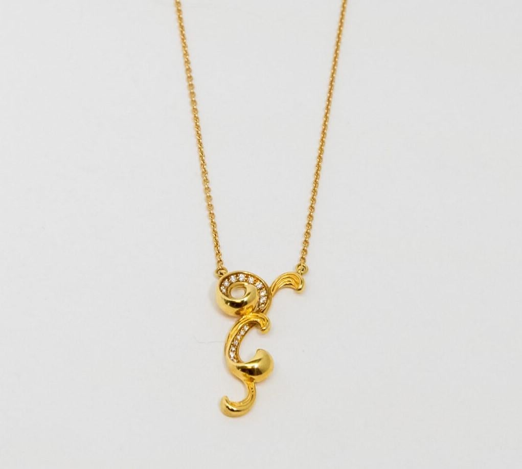 18K Yellow Gold pendant. 18K Yellow Gold Rolo chain with lobster claw lock. This piece is decorated with 21 Diamonds (~0.12ct).

Length: 24 cm