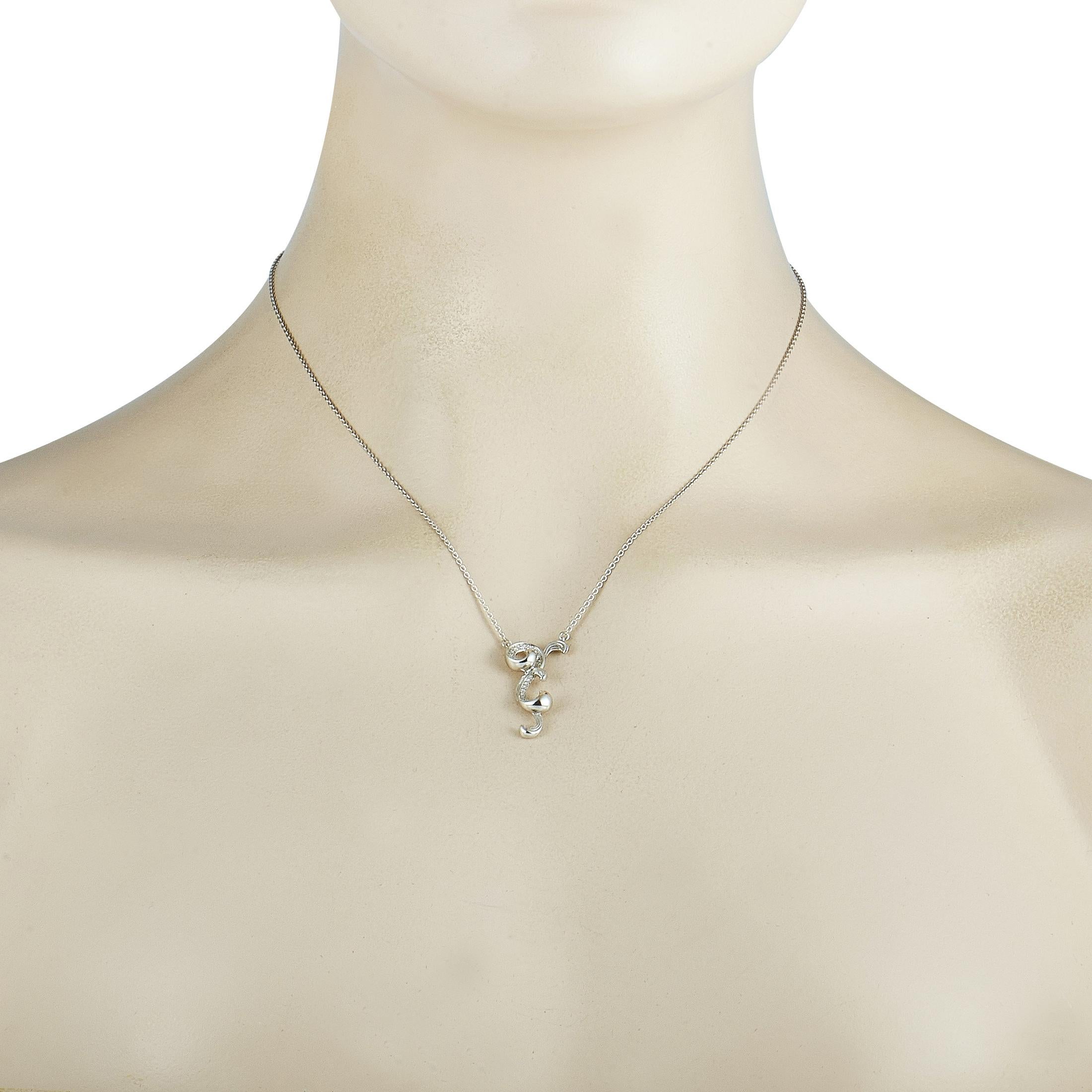 he Carrera y Carrera “Origen Mini” necklace is made of 18K white gold and embellished with diamonds that amount to 0.13 carats. The necklace weighs 5.98 grams and is presented with a 16” chain and a pendant that measures 1.12” in length and 0.55” in