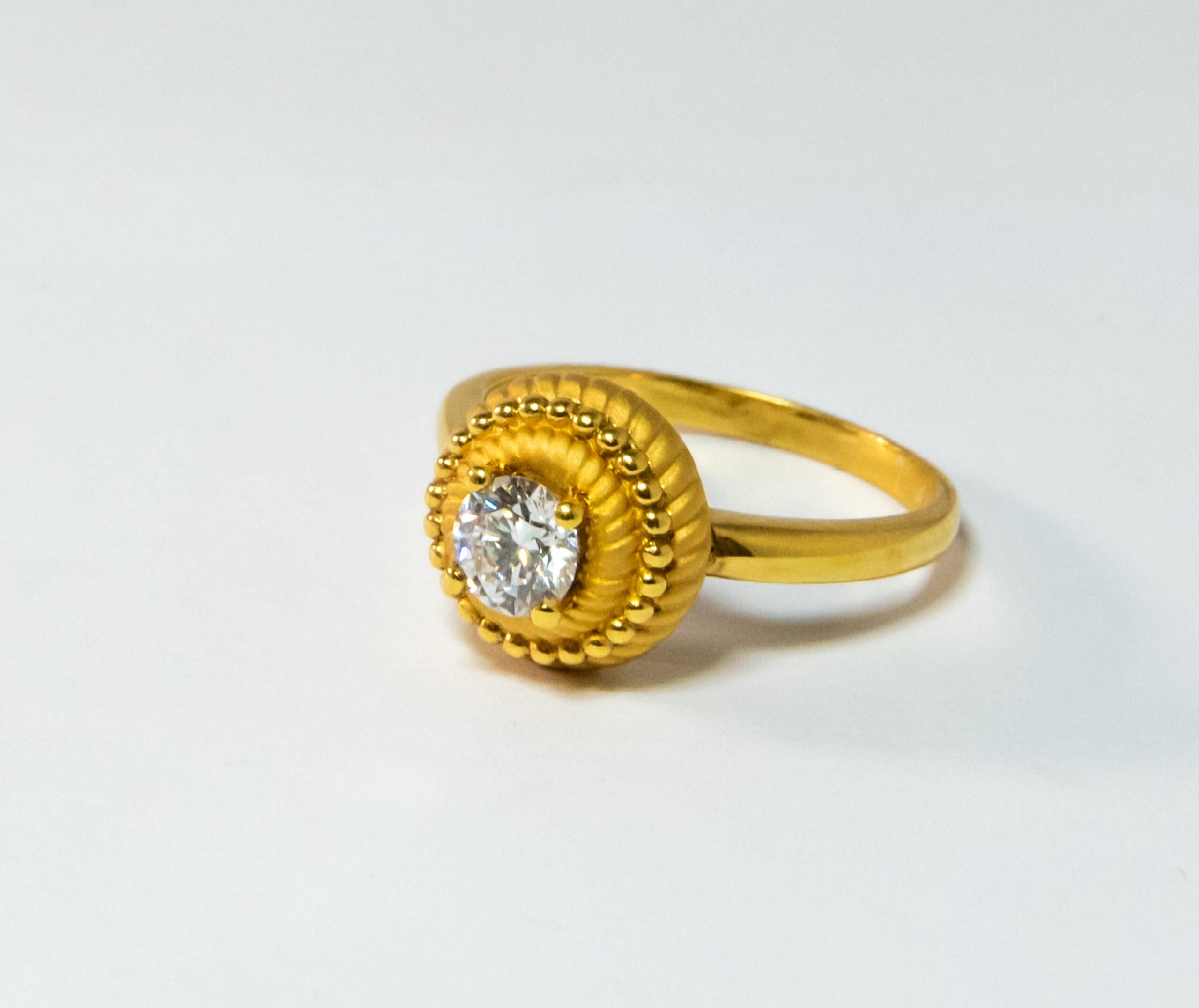 This ring is made of 18K Yellow Gold. It is decorated with a round-cut diamond (~0.50ct).

Size – 54 (6.75 US)