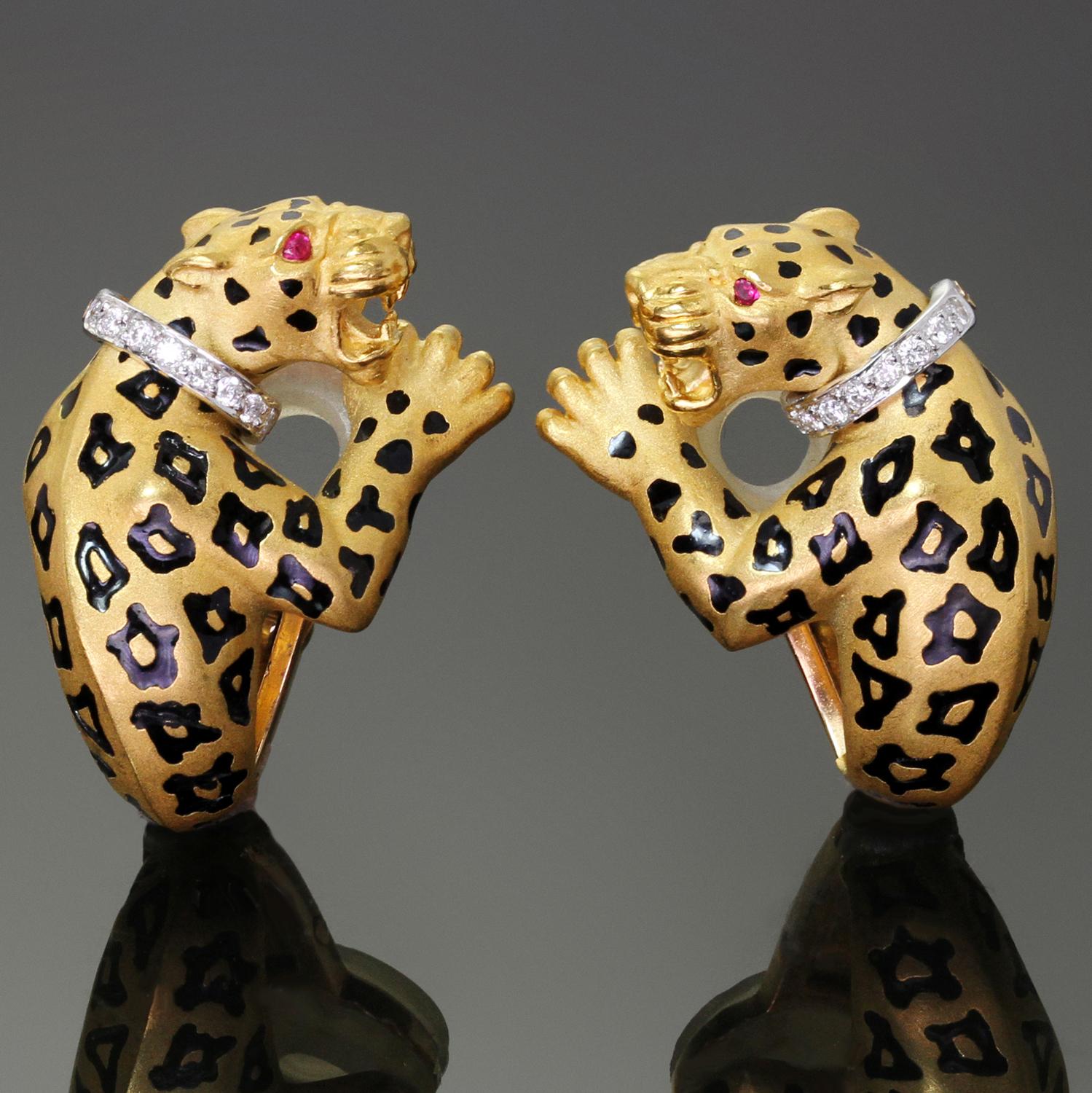 These gorgeous Carrera y Carrera clip-on earrings are crafted in 18k yellow gold and accented with red ruby eyes, black enamel spats, and round brilliant-cut F-G-H VVS2-VS1 diamonds weighing an estimated 0.16 carats. Made in Spain circa 1980s.