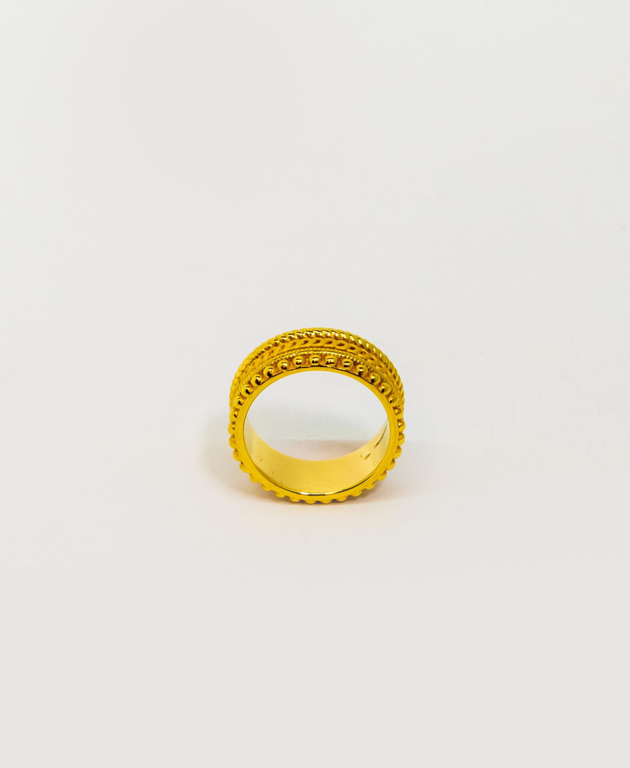 This ring is made out of 4 ring made of 18K Yellow Gold. All 4 rings have a different “chain” styles and connected in one piece.

Size – 54.5 (7 US)