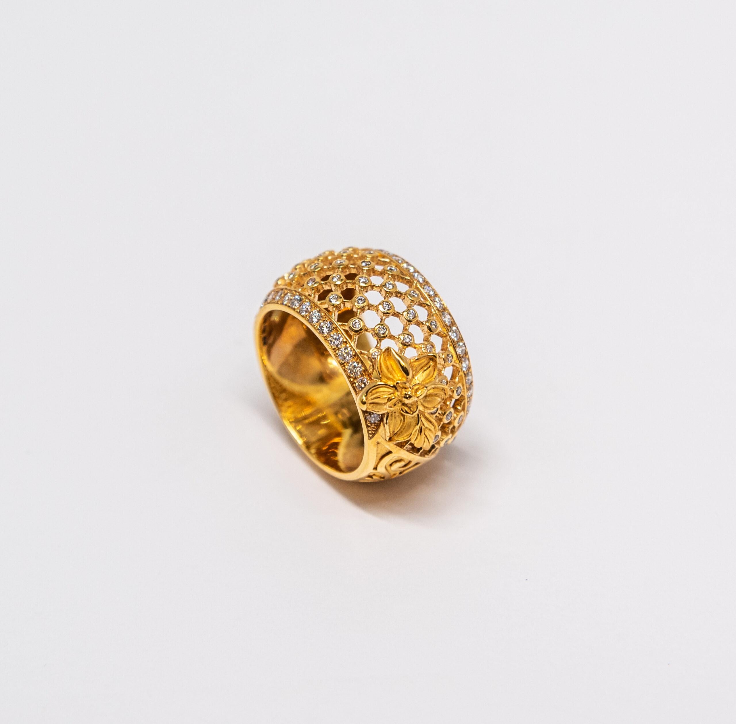 This ring is made of 18K Yellow Gold. The net pattern is set with 75 Diamonds (~0.68ct) and yellow gold handmade flower.

The Size – 56 (7.5 US)