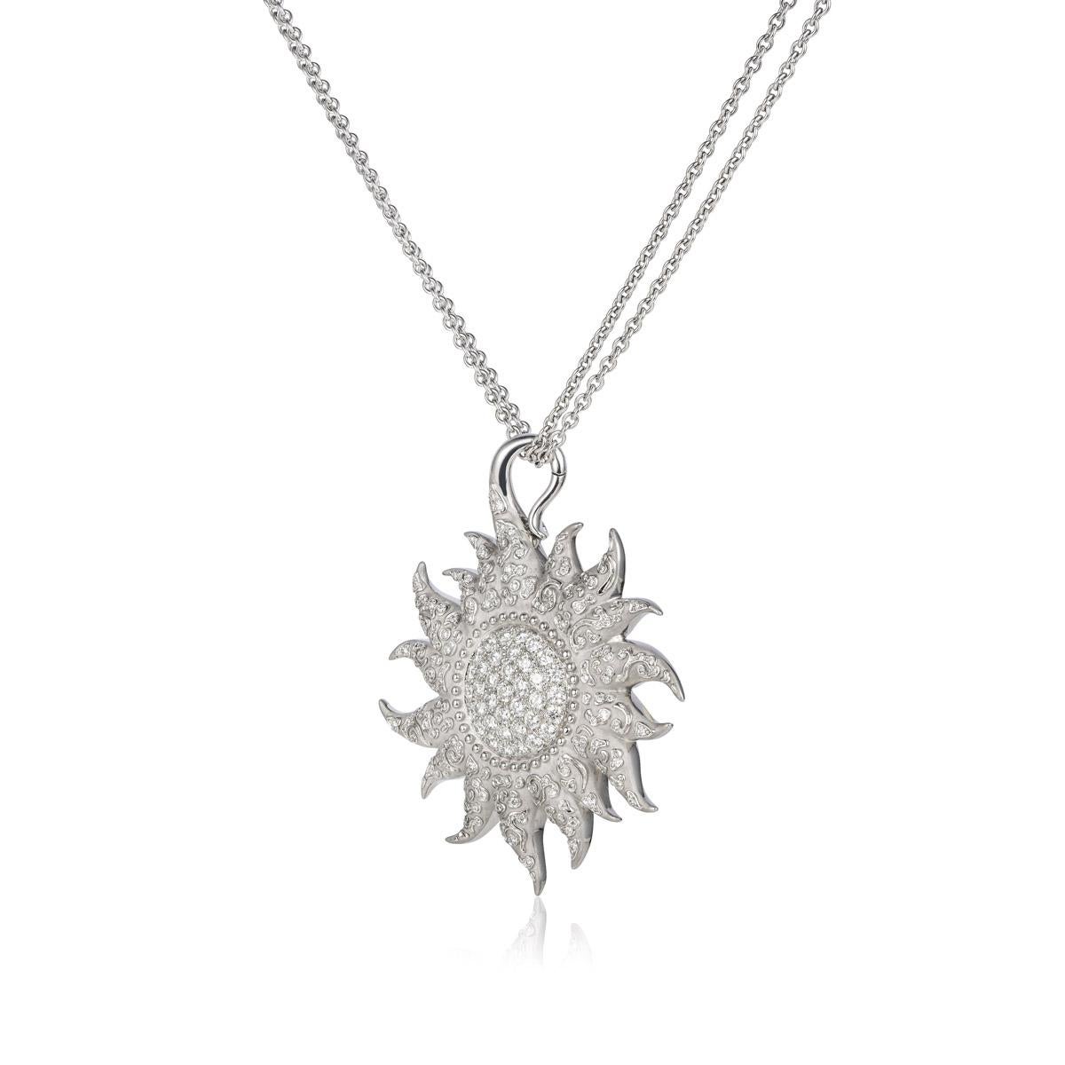 Shine bright with the Sol y Sombra Diamond Sun Necklace. Featuring a stunning diamond pendant, this necklace is perfect for the fashionista who wants to add a touch of elegance to any outfit. Embrace your inner sparkle and make a statement with this
