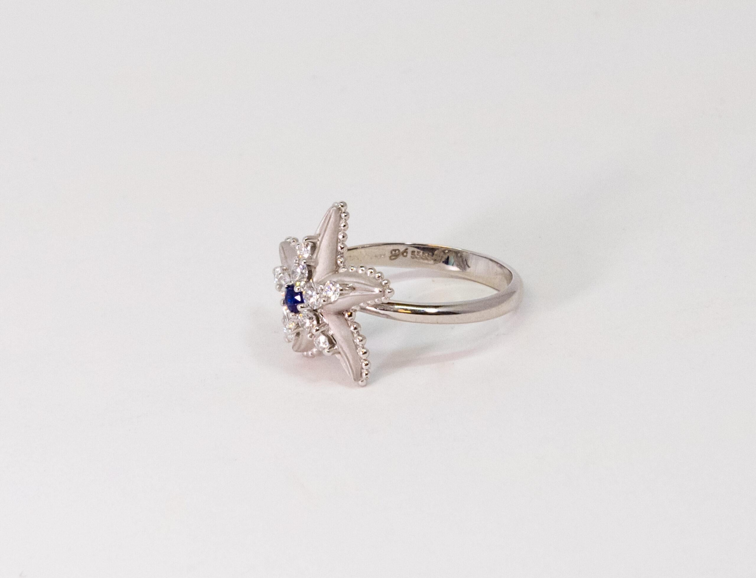 10076589 Carrara Y Carrara
This ring is made of 18K White Gold. The starfish-shaped front side is decorated with Blue Sapphire main stone (~0.09ct) and diamonds (~0.65).

Size – 52.2 (6 US)