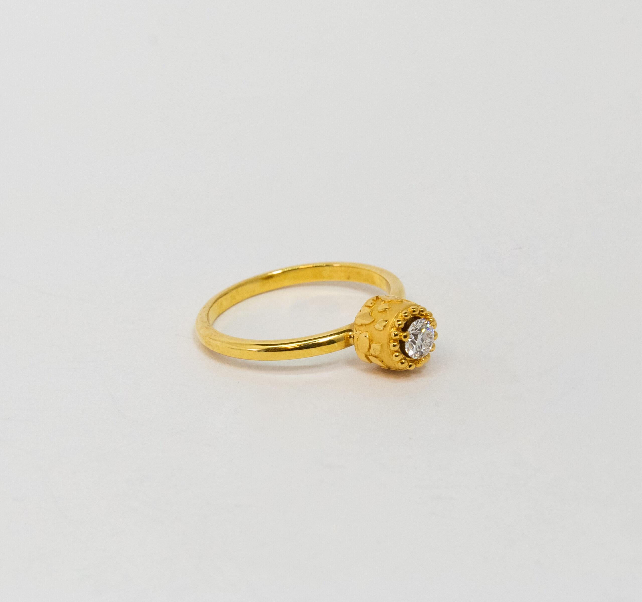 This ring is made of 18K Yellow Gold. It is decorated with a round-cut diamond (~0.20ct).

Size – 56 (7.5 US)