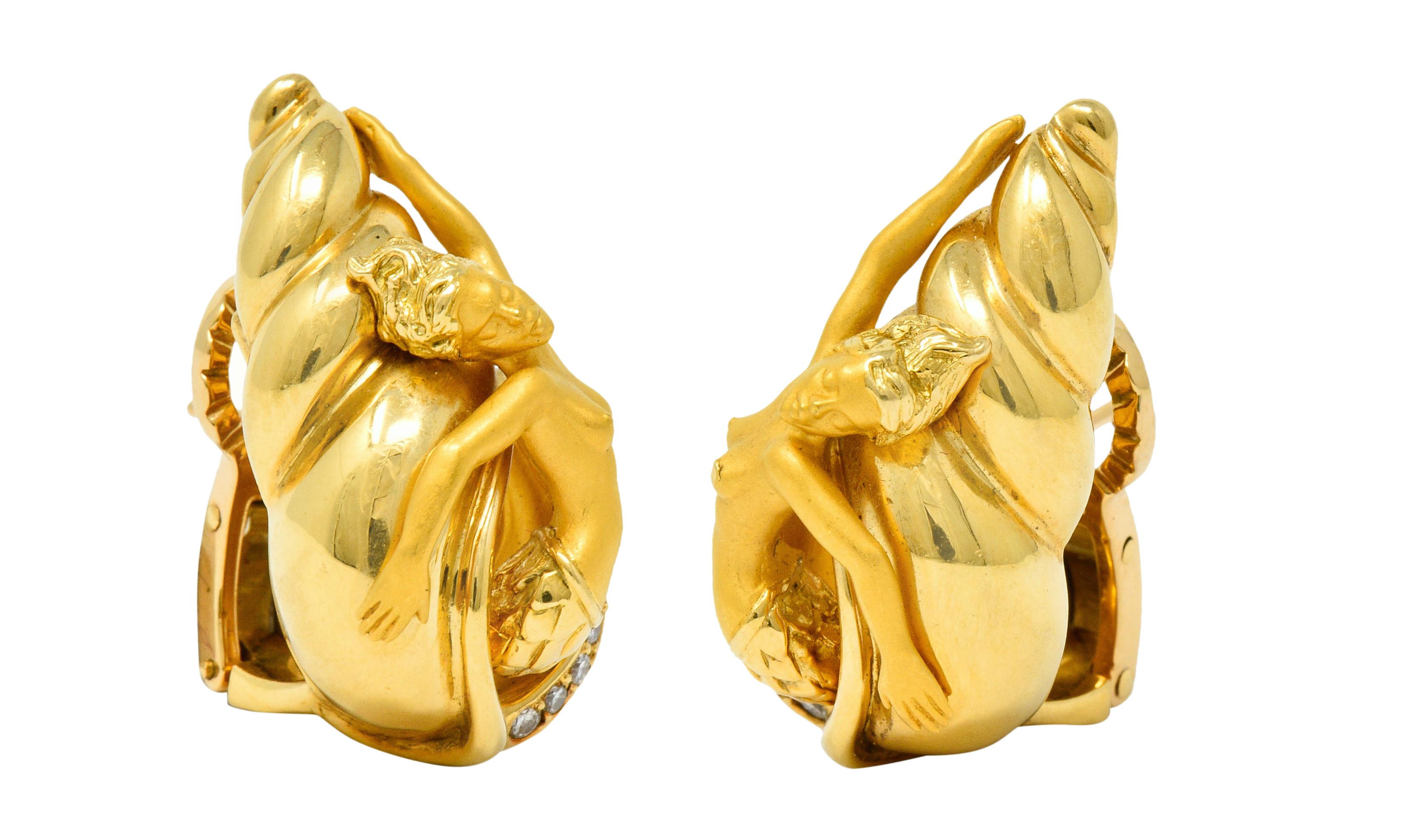 Incredibly rendered earrings are designed as a mermaid emerging from a spiraled and brightly polished shell

Her body is elegantly formed with a matte gold finish

Shell is accented by round brilliant cut diamonds weighing approximately 0.20 carat;