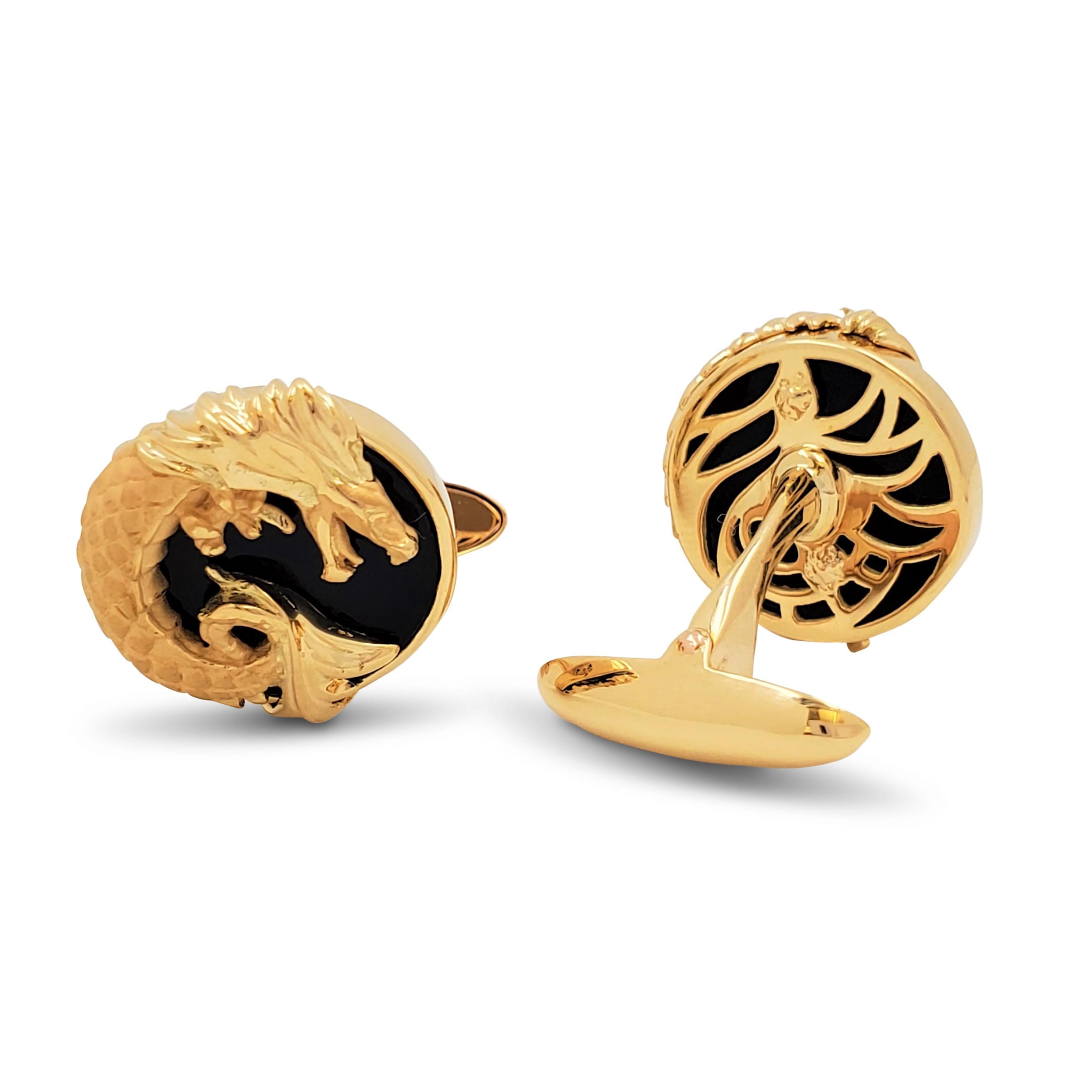 Authentic Carrera Y Carrera 'Circulo de Fuego' elegant cufflinks crafted in 18 Karats yellow gold and onyx. Features two magnificent dragons, universal symbols of strength and power, imperially set on 2 black onyxes. The cufflinks measure 8mm in